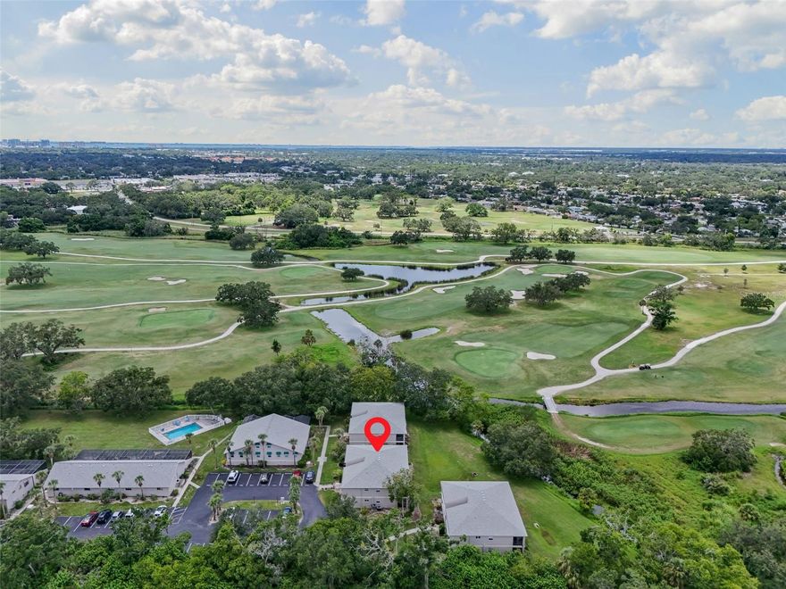 Discover this beautifully updated main floor condo 2-bedroom, 2-bath plus office, perfectly positioned with stunning views of the newly redesigned Bobby Jones Golf Course. This Unit is tucked away toward the back of The Hideaway Community and is move in ready with hard surfaces throughout this entire unit and no carpeting.  Kitchen features 2 tone modern cabinetry with granite counters and stainless appliances. Each Bathroom is updated with full tiled showers and nice size vanities with modern fixtures. The Living room and dining are spacious and versatile for any furniture type with plenty of wall space to display coastal art or hanging tv's. Additional features include a full-size in-unit laundry area, ample storage closets, and a screened lanai—ideal for relaxing with morning coffee and a private view. This unit also comes with two prime parking spaces located just steps from the front door. This maintenance free community also offers access to two pools. Located in the heart of Sarasota just off I-75 and Fruitville Road, you’ll enjoy quick access to golf, scenic bike trails, Parks, the UTC Mall’s premier shopping and dining, vibrant Downtown Sarasota, and the world-famous Siesta Key beaches. Whether you’re looking for a full-time residence or a seasonal retreat, this property also offers excellent rental potential when you’re away. Enjoy Florida living at its finest!