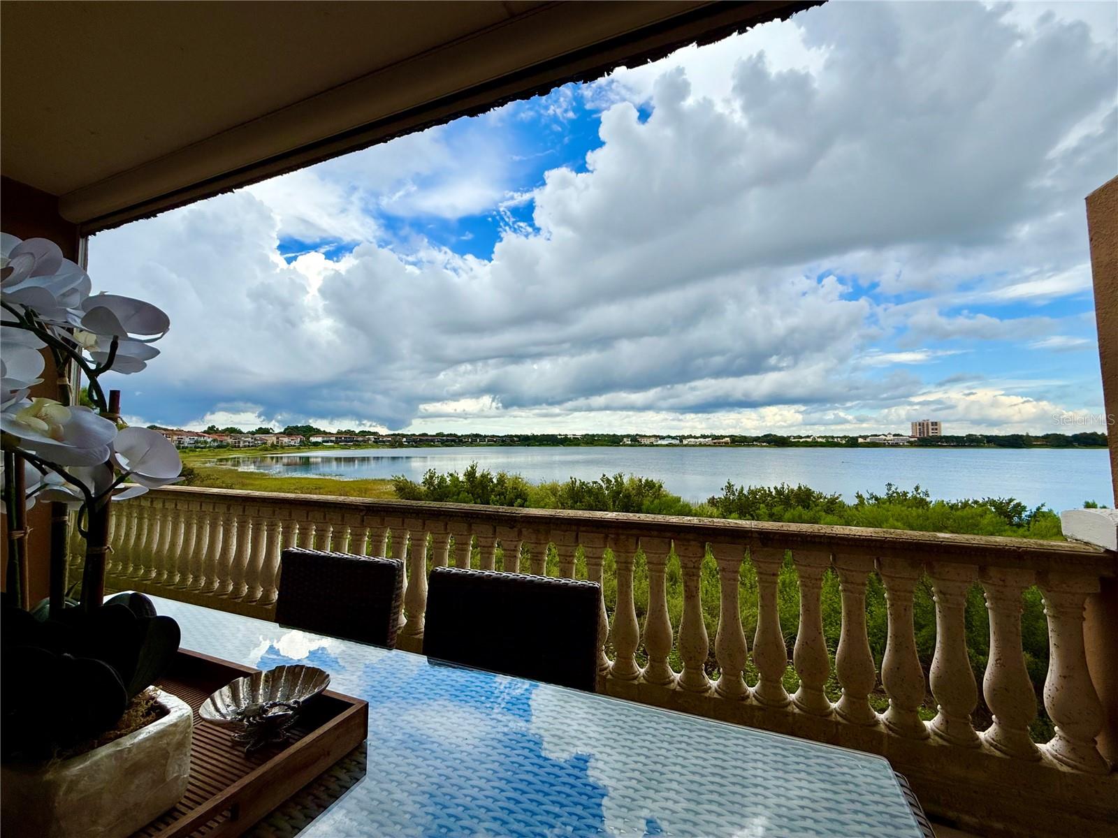 Turn-Key Lakefront Luxury at Vizcaya.
Welcome to your fully furnished, move-in ready lakefront retreat at Vizcaya, one of Orlando’s most desirable guard-gated communities. This elegant 2-bedroom, 2-bath condo blends comfort, style, and breathtaking views of Little Sand Lake.
Step inside to an open layout with panoramic lake views from both the master suite and the spacious living room. The home’s large balcony with automatic screen extends your living space outdoors, perfect for morning coffee or sunset entertaining.
The gourmet kitchen features stainless steel appliances, a breakfast nook, and pass-through window to the living room, and comes fully stocked with dinnerware, utensils, and cookware. Custom lighting throughout the home sets the mood for any occasion.
The primary suite offers balcony access, a king-size automatic tilt bed, wall-mounted TV, walk-in closet, and a spa-style bath with dual vanities, soaking tub, glass-enclosed shower, and private water closet. The second bedroom includes a large closet with an adjacent full bath. A laundry room with washer/dryer and custom cabinetry completes the interior.
This home is offered fully furnished as shown in the photos, with the exception of the seller’s personal items and office equipment.
Additional highlights include one garage space, one outdoor parking space, a garage storage unit, and access to all Vizcaya amenities: lakefront pool, tennis courts, fitness center, and 24-hour security.
Located in the heart of Dr. Phillips, this home is just minutes from Restaurant Row, world-class shopping, theme parks, and Orlando International Airport.
