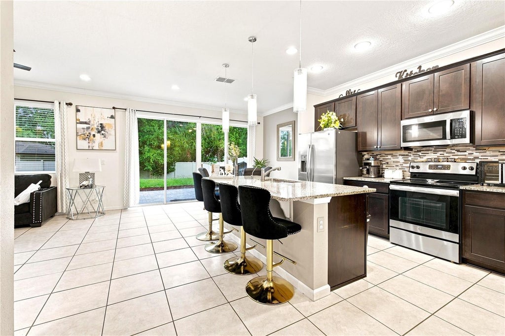 Photo of 3821 Pinewood Gardens Boulevard, Saint Cloud, FL 34769 (MLS # TB8537436)