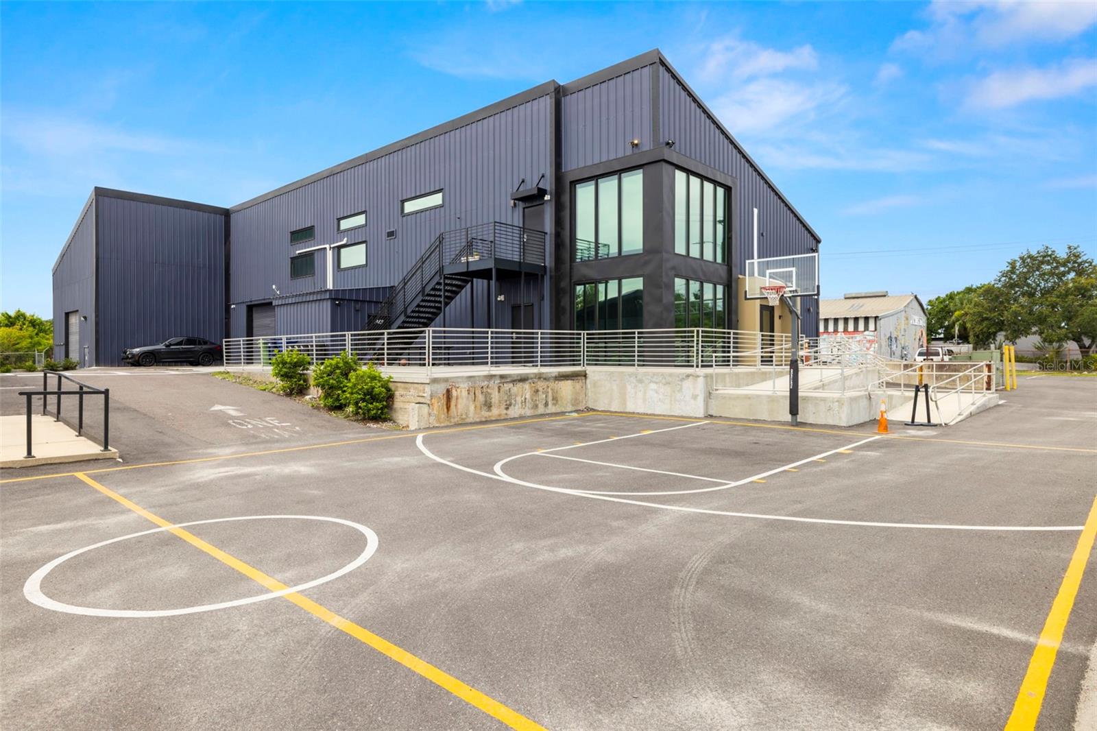 Located at 3605–3615 E. 7th Avenue in the heart of Ybor City, this exceptional ±16,962 SF office and industrial assemblage offers a rare turnkey opportunity for investors or owner-users seeking a versatile, income-producing asset in one of Tampa’s fastest-growing corridors. Zoned IG (Industrial General) and situated within a federally designated Qualified HUBZone, the property features four separate buildings including ±11,530 SF of office/warehouse space, a ±2,000 SF office, and a ±3,432 SF warehouse currently leased to a long-term bakery tenant. With approximately 255 feet of frontage directly on 7th Avenue and 61 onsite parking spaces, this move-in-ready site has undergone full renovations and offers flexible layouts, high ceilings, modern finishes, and upgraded infrastructure. The property benefits from direct access to major thoroughfares including Adamo Drive, I-4, I-275, Selmon Expressway, and N. 22nd, 34th, 36th, and 50th Streets, with proximity to Downtown Tampa, Palmetto Beach, Historic Ybor, and the Port of Tampa, and is just 20 minutes from Tampa International Airport. Situated in a flood zone X and supported by TECO electric, City of Tampa utilities, and fiber-ready communications, this asset is surrounded by explosive commercial and residential growth. With a total population of nearly 224,000 and approx average household incomes over $66,000 within a 5-mile radius, this high-visibility, income-generating property is ideally suited for distribution, light manufacturing, showroom, tech, flex, or creative uses. This is a premier opportunity to own or invest in a highly visible and dynamic Tampa Bay location.