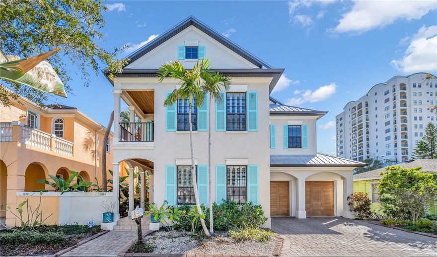 Discover the epitome of downtown Sarasota living in the serene ambiance of Laurel Park, a historic neighborhood known for its charm and quiet streets. Presenting a stunning Custom Craftsman-style home, meticulously constructed in 2007, that seamlessly blends sophistication with the warmth of home. Spanning an impressive 3,142 SF, this residence is a masterpiece of design and comfort, boasting 4 bedrooms and 3.5 baths, enveloped in the timeless beauty of a metal roof and the inviting allure of 4 covered porches. Elevate your lifestyle with unparalleled amenities, including two gas fireplaces that add a touch of elegance and warmth to the living spaces, a whole-home water softener + filtration system, and experience the convenience of an in-home elevator, simplifying daily living and adding a luxurious touch. The architectural grandeur is heightened by 10-foot ceilings and 8-foot interior doors, creating an open, airy ambiance complemented by the rich textures of hardwood floors throughout. The heart of this home is its professional kitchen, equipped with a gas stove and adorned with custom solid wood cabinetry, where culinary creations come to life. An artist’s loft-style studio offers a sanctuary for creativity, while the handcrafted oak staircase stands as a testament to the home’s exquisite craftsmanship. Additional features include a spacious two-car garage and a private pool, nestled within a dramatic two-story screen enclosure, offering an oasis of relaxation and entertainment. The paver drive, side, and rear privacy wall, coupled with lush tropical landscaping, create a secluded retreat in the heart of the city. Located just 3 blocks from Main Street, Burns Court, and the Bayfront, this home offers unparalleled access to the best of Sarasota’s dining, shopping, and cultural experiences. With its blend of luxury features, including balconies for serene outdoor living, and its prime location in one of downtown Sarasota's most coveted neighborhoods, this residence is not just a home, but a lifestyle choice for those seeking the best in urban living.