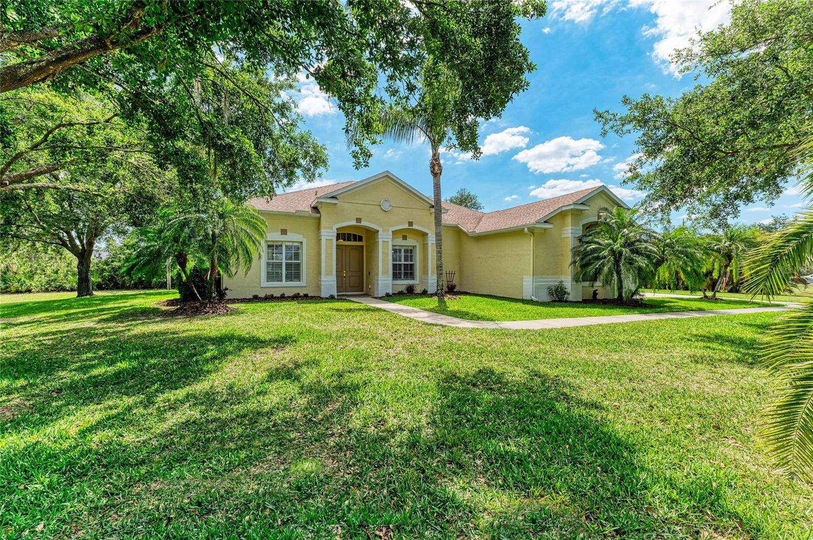 Welcome to this beautifully maintained 4-bedroom, 3-bathroom home with a dedicated office and spacious 3-car garage, ideally situated on one of the most private lots in The Preserve at Panther Ridge. Surrounded by mature landscaping and lush hedges, this residence offers a serene retreat with all the modern comforts.
Step through impressive 8-foot double doors into a bright and open living room with expansive views of the refinished pool and private backyard. The formal dining room is perfect for hosting family gatherings or entertaining guests.
The office, located at the front of the home, boasts large windows overlooking majestic trees—ideal for peaceful work-from-home days.
The primary suite is a true retreat, featuring sliding doors that open to the pool and patio, dual walk-in closets, and a recently remodeled en-suite bathroom with dual vanities and a large walk-in shower.
The kitchen is a chef’s delight, complete with tall upgraded cabinets, a new oven, a breakfast bar, granite counters, and a charming breakfast nook framed by a stunning aquarium window. The adjacent family room flows effortlessly from the kitchen and opens to the outdoor area with large sliding glass doors.
End your day by relaxing in your gorgeous refinished pool, surrounded by paved decking and a Clearview pool cage for uninterrupted views.
Community Amenities Include:
• Scenic walking trails
• Parks and playgrounds
• Basketball and tennis courts
• A friendly, vibrant atmosphere
Location Perks:
Minutes from Waterside Place, Lakewood Ranch Main Street, and UTC Mall — enjoy convenient access to world-class shopping, dining, and entertainment.
Additional Highlights:
• No CDD fees
• Low HOA
• New Roof (2020)
• New AC
• Motorized Shades
• Decorative Chair Railing
• Built-in Steel Cabinets in the Garage
Don’t miss your chance to own this private paradise in one of Lakewood Ranch’s most desirable communities.