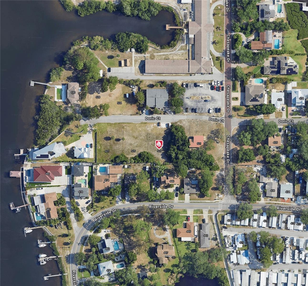 Prime Location & Endless Potential! This nearly ¼-acre oversized lot (90x113) sits in a highly sought-after area surrounded by luxury waterfront estates. Future construction will need to be elevated with parking/garage underneath, opening the door to breathtaking water views and a spacious design. With ample room to add a pool, you can create the ultimate coastal retreat. Just minutes from beaches, boat ramps, dining, shopping, and more. All with no HOA restrictions. The ideal canvas to bring your dream home to life!