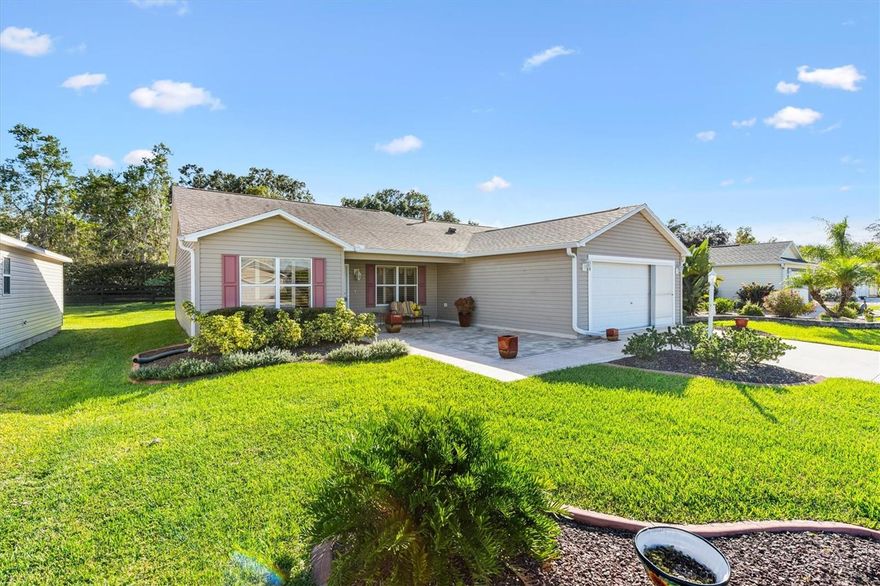 This beautiful 3 Bedroom, 2 Bath home in THE VILLASGES, Florida, is one you’ll want to see right away because it won’t last long! Located in a highly desirable area with NO BOND, this residence offers an open-concept design with vaulted ceilings, CROWN MOLDING, and exquisite GRANITE countertops throughout home.  The Kitchen Features a GRANITE backsplash, GRANITE ISLAND, and GAS range, making it perfect for both cooking and entertaining. The split-bedroom floor plan provides privacy, with a Primary suite showcasing an UPGRADED shower, dual sinks in GRANITE counter, California style walk-in closet.  The second bedroom features a MURPHY BED.  Third bedroom has a closet but is currently used as an office.  Enjoy the comfort of newer systems, including a NEW HVAC (2017), NEW ROOF (2020), along with gorgeous LAMINATE Flooring throughout. Additional highlights include an inside laundry room, two-car garage with a sliding screen door, decorative painted driveway, and brick-paver patio that adds charm to the home’s exterior. Relax on the welcoming front porch or in the enclosed FLORIDA room with TILE Flooring, which also opens to an outdoor patio ideal for grilling. This home is perfectly situated with easy golf cart access to shopping, Lake Sumter Landing town square, medical facilities, and numerous golf courses, where you can enjoy free golf on all Executive courses. Don’t let this one slip away!  Furniture package negotiable.