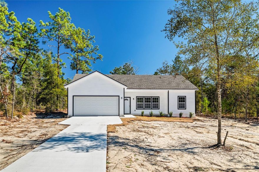 **NO HOA**NEW BUILD**HUGE LOT** This BRAND NEW 2025 HOME by a CUSTOM BUILDER (will consider all buyer requests) offers a rare opportunity to own a high-quality, private retreat with NO HOA. Constructed with durable Hardie lap siding, this home sits on over 1/3rd of an acre, providing plenty of room for you to bring outdoor toys. The property is nestled on a private wooded lot away from neighbors, tucked within a QUIET neighborhood with paved access roads and an extended driveway. Inside, you will find 10FT SOARING CEILINGS and an OPEN FLOOR PLAN with a spacious living room. The interior features laminate flooring throughout main living areas, and NEW CARPET in all bedrooms. This home is truly MOVE IN READY, featuring brand new everything, indoor laundry, and an extended back patio for enjoying the serene surroundings. Notably, there is NO septic mound. Perfectly located for nature lovers, you are close to Little Lake Geneva and the Ocala National Forest. Schedule your showing today!