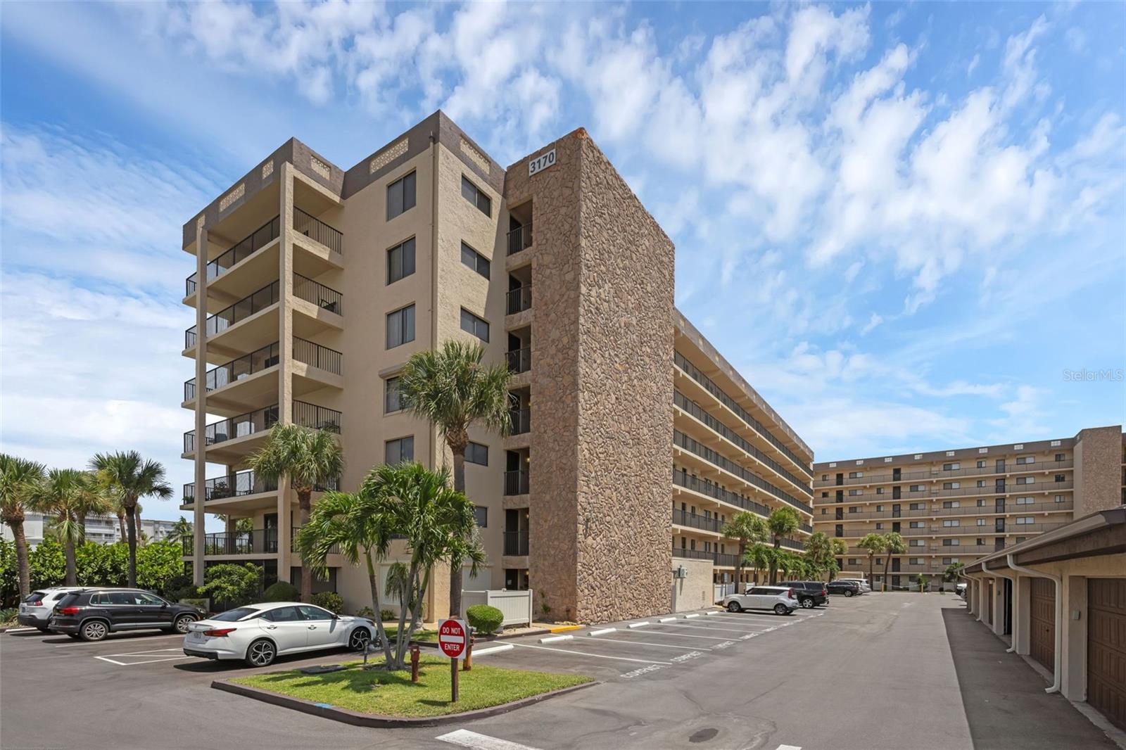 Welcome to Windrush, Unit 708 – a rare 7th-Floor Furnished End Unit offering 1,852 Square Feet of Fully Updated Coastal Living with Breathtaking Panoramic Views. From the moment you step inside, the Open-Concept Layout draws your eye straight to the Sparkling Atlantic Ocean and Pristine Shoreline. Beautiful Wood-Look Ceramic Tile flows throughout, creating a Clean, Modern, Low-Maintenance Living Space. The Kitchen showcases Sleek Quartz Countertops, Stainless Steel Appliances, Abundant Cabinetry, and a Breakfast Bar - perfect for casual meals or entertaining. The Dining Area opens to a Spacious Living Room, where Three Hurricane-Impact Sliders flood the space with natural light and frame the incredible Beach Views. The Primary Suite offers its own Hurricane-Impact Slider to the Wraparound Patio, a Generous Walk-In Closet, and a Spa-Inspired En Suite with Quartz Double Vanity and Walk-In Shower. Both Guest Bedrooms are well-sized with Built-In Closets and Retractable Storm Shutters for added security. Step outside to the Expansive Covered Patio and enjoy Sweeping Vistas of the Atlantic Ocean and Banana River - perfect for Sunrises, Sunsets, Rocket Launches, and Nature Watching. This unit includes a Dedicated Two-Car Garage with Automatic Opener and Ample Guest Parking. Windrush offers Resort-Style Amenities including a Heated Pool, Clubhouse, Tennis Courts, Shuffleboard, and Private Beach Access - just steps away for Surfing, Fishing, and Leisurely Walks on World-Famous Cocoa Beach. The 32931 Area features Vibrant Dining, Boutique Shopping, Art Galleries, Golf Courses, Marinas, Waterfront Parks, and Year-Round Festivals. With Port Canaveral, Kennedy Space Center, and Orlando Attractions nearby, this location blends Small-Town Beach Charm with World-Class Convenience - making it the perfect place to Live, Vacation, or Invest.