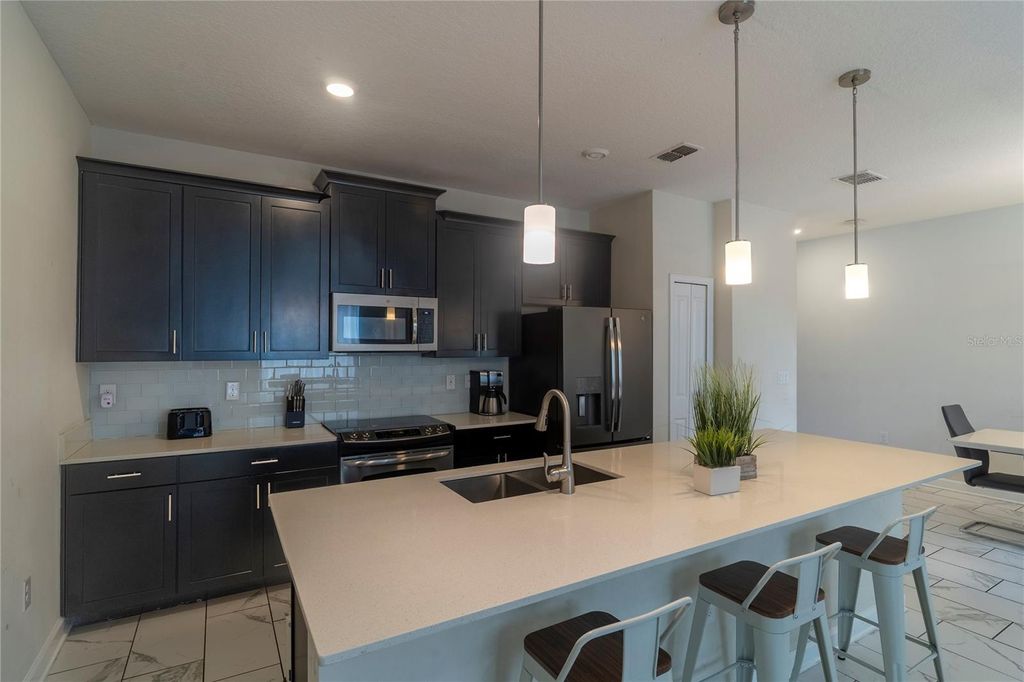 Photo of 436 Ocean Course Avenue, Davenport, FL 33896 (MLS # O6356961)