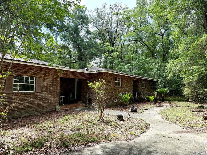 Nestled in the heart of Jonesville, this 2 bedroom, 1 bathroom fixer upper is full of potential for investors, renovators, or buyers looking to create their dream property. Situated on nearly 2 wooded acres, the possibilities are endless. Renovate the existing home into a charming primary residence or income producing rental, or take advantage of the expansive lot to build your custom dream home.

The location is hard to beat, just minutes from Tioga Town Center and conveniently located across from Publix, medical facilities, gyms, restaurants, shopping, and more. Enjoy the privacy and beauty of a wooded setting while still being close to everything Jonesville has to offer.

Bring your vision and imagination to unlock the full potential of this unique property.