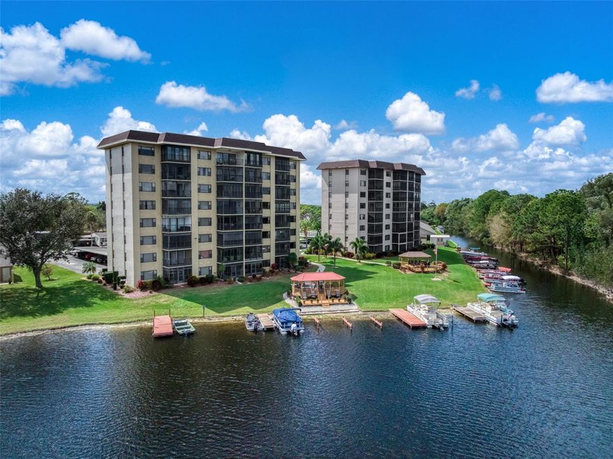 Wake up to beautiful views of 517-acre Lake Grassy from this inviting 2nd-floor waterfront condo in Lakeshore Tower One. This residence offers something buyers often look for but rarely find—peaceful water views, thoughtful updates, and a setting that instantly feels calm and welcoming. Filled with natural light, the comfortable living and dining areas create a bright and inviting atmosphere from the moment you step inside. The home features luxury vinyl plank flooring, fresh interior paint, updated electrical outlets, stylish fixtures, updated ceiling fans, efficient Whirlpool appliances, and a newer HVAC system with a digital thermostat for year-round comfort. Both bathrooms have seen updates, including a renovated guest bath featuring porcelain tile flooring and a granite vanity countertop, along with a cultured marble shower and several ADA-friendly features designed for added accessibility. The enclosed Florida room extends the living space and is the perfect place to enjoy your morning coffee or tea, relax with a book, or unwind while taking in the breathtaking lake views. Residents enjoy a true Florida lifestyle with amenities including a spacious gazebo, sun deck, BBQ gas grill, on-site boat slips, beautifully maintained grounds, elevator access, shared laundry rooms, secure storage, and covered parking, while the HOA provides a low-maintenance living experience with many essentials included, such as water utility. Located just minutes from the charm, murals, shops, dining, and local attractions that make Lake Placid so special, this condo offers the perfect blend of comfort, convenience, and lakeside living. Whether you're searching for a year-round home, a winter getaway, or an easy lakeside retreat, this condo offers comfort, updates, and value all in one. Schedule your private showing today and come experience it for yourself.