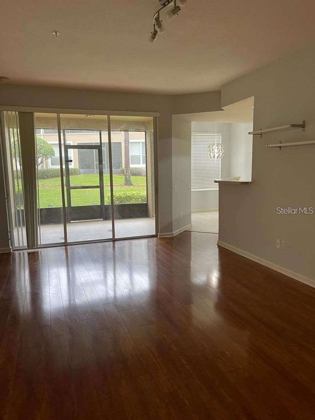 Photo of 6443 Axeitos Terrace #107, Orlando, FL 32835 (MLS # O6393312)