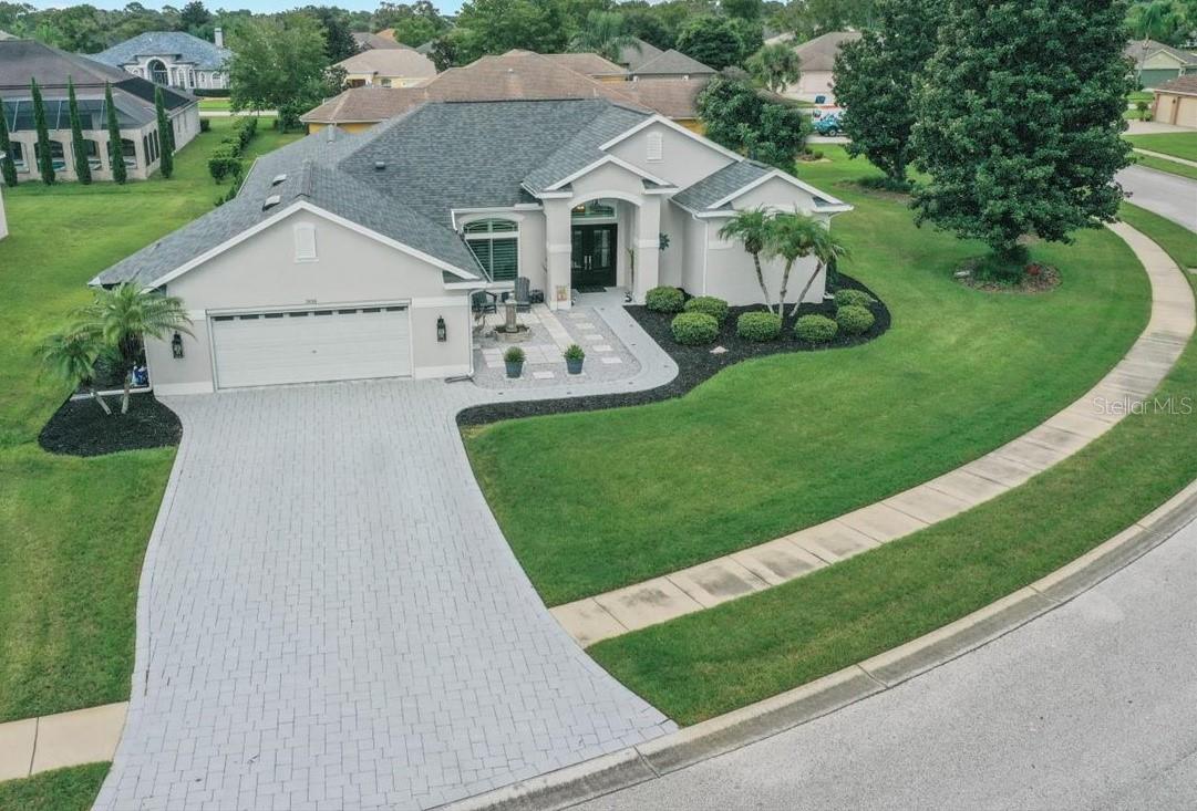 One or more photo(s) has been virtually staged. 4 BEDROOMS + 3 FULL BATHROOMS + RENOVATED KITCHEN (2023) + SUN-SHELF POOL WITH WATERFALL + NEWER AC SYSTEM (2018) + NEW DUAL-PANE WINDOWS (2020). Need space to spread out? Love pool days? Set on an ALMOST HALF ACRE CORNER LOT, this home welcomes you with a BRICK PAVER DRIVE and a NEW Pella front door (2020). Inside: tile in all living areas, plantation shutters, and a smart flow—foyer to a large great room, a versatile game/family room, and a flexible nook/den. The RENOVATED KITCHEN (2023) brings soft-close cabinets, QUARTZ counters, stone backsplash, pot filler, custom hood + new stove, TWO MICROWAVE DRAWERS, under-cabinet lighting, and an eat-in nook/dinette. Just off the game room is an ENTERTAINING BAR WITH WINE COOLER. The primary suite is spacious with pool access, his & hers closets with built-ins, and a spa bath with GARDEN TUB + walk-in shower. Thoughtful split plan: Bedrooms 2 & 3 share a Jack-and-Jill bath; Bedroom 4 sits by the third full bath. Outside, the screened lanai frames a SUN-SHELF POOL WITH WATERFALL on a paver deck—updated in 2023 with new Diamond Brite finish (2023), new tile (2023), a new variable-speed pump (2023), a rescreened cage (2023), and freshly sealed pavers. Backyard is chain-link fenced and ready for your pets! Big-ticket items handled: 50-YEAR ROOF (2020), NEW DUAL-PANE WINDOWS (2020), NEWER AC SYSTEM (2018), new gutters (2023), exterior paint (2024), plus an added feature: a remote-controlled garage screen. GATED COMMUNITY (PRISTINE PLACE) with low HOA, no CDD, no flood zone. Amenities include a clubhouse with pool and fitness center, plus tennis and basketball courts. Spring Hill living with everyday convenience—3 minutes to Publix, 5 minutes to the Suncoast Parkway, and walking distance to Challenger K-8. Easy commute to Tampa, close to parks, dining, and shopping.