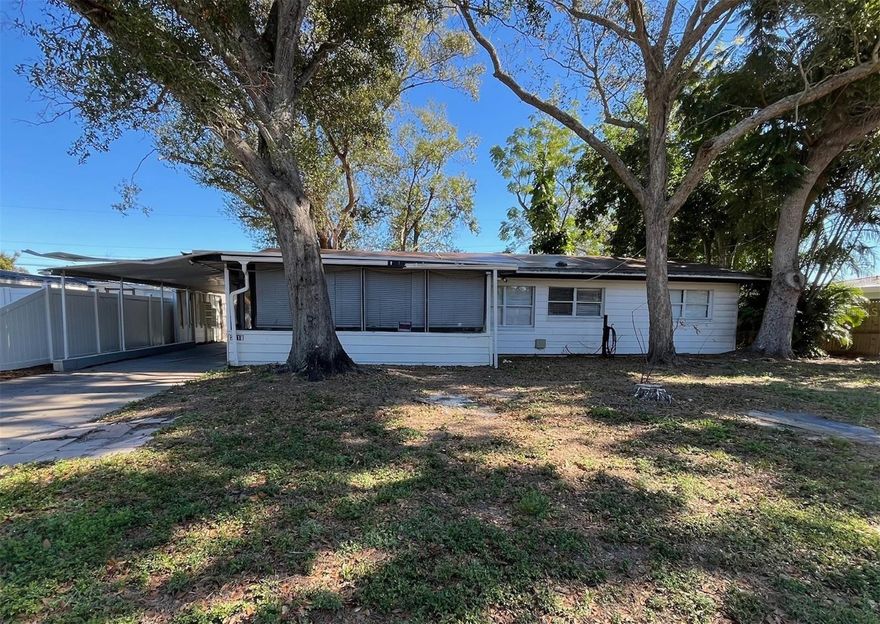 Do you need more rooms, a fenced back yard, a screen porch and covered parking that doesn't cost a lot?  This is it!  Home has Living room, updated kitchen & bath, family room, Florida room, storage room.  Close to baseball stadium, public park and playground.
Are you handy or have contacts for fixing?  Yeah, that works.  Call your agent today to set up an appointment to see this diamond in the ruff.
Due to condition, the property may have health/safety risk(s). Prior to entry / access, all parties must sign a Hold Harmless Agrement, and the property may only be shown by appointment.  
This property may qualify for Seller Financing (Vendee).  
If property was built prior to 1978, Lead Based Paint Potentially Exists.