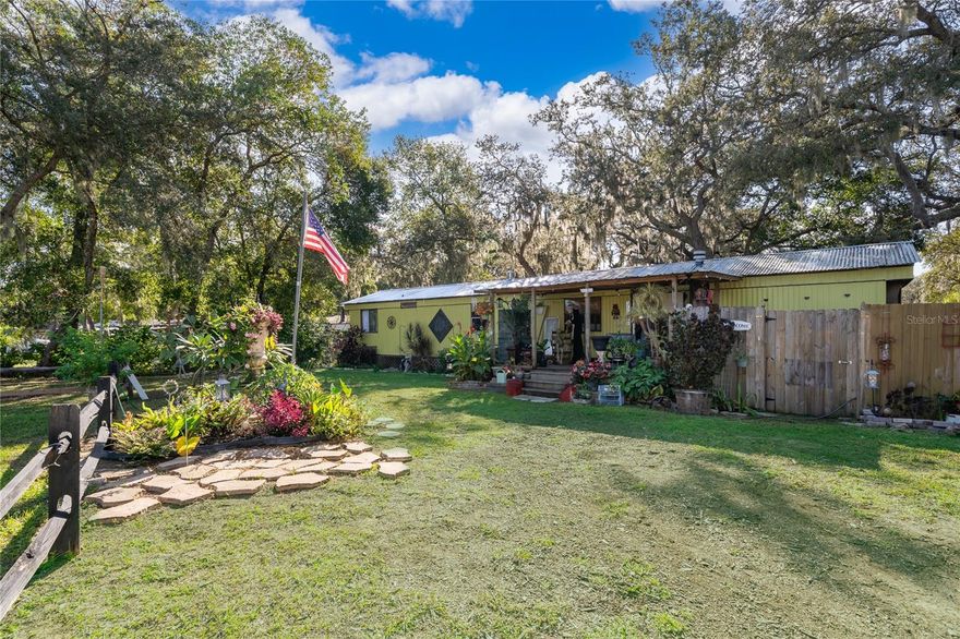 Welcome to this charming 2-bedroom, 2-bathroom home, perfectly situated on a spacious half-acre lot surrounded by nature. Nestled in the heart of Lake County and just moments from Lake Eustis and several other beautiful lakes, this home offers the ideal blend of tranquility and convenience. Located near Leesburg International Airport, you’ll enjoy easy access to town while still relishing the peace of a private, tree-lined setting. Step inside to discover fully remodeled bathrooms and cozy living spaces designed for comfort. Whether you’re looking for a serene retreat or a full-time residence surrounded by natural beauty, this home is the perfect place to unwind and enjoy Florida living at its best.