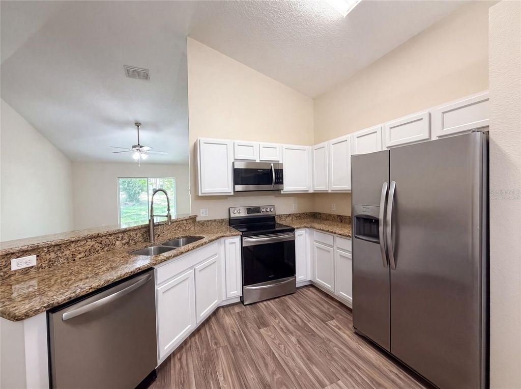 Photo of 33137 Irongate Drive, Leesburg, FL 34788 (MLS # O6426508)