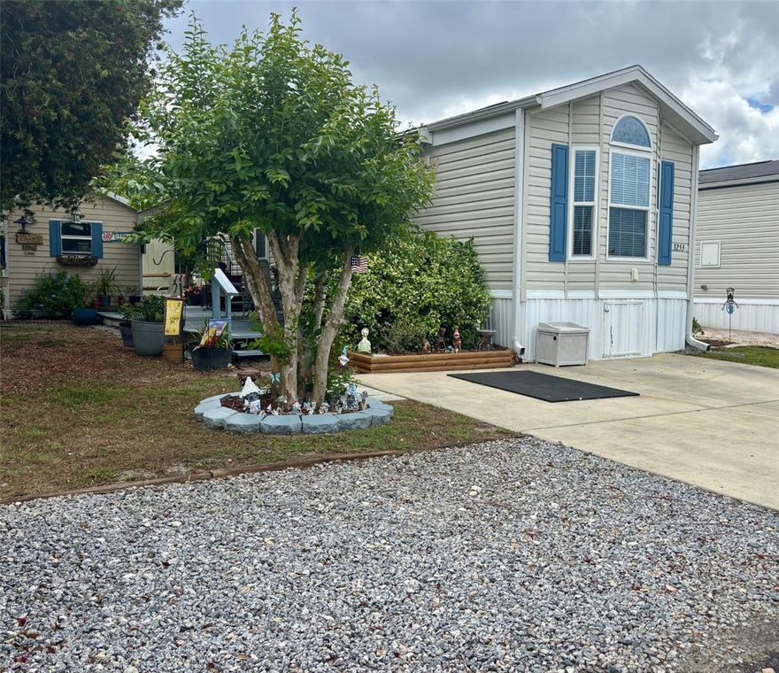 Come relax and soak in the Florida sunshine in this light-filled 2017 park model, ideally located in the highly desirable Town Park section of Wilderness RV Park. This charming home invites you to unwind—whether you're enjoying your spacious side deck surrounded by the fragrant scent of jasmine or sipping your morning coffee on the private back patio overlooking a tranquil pond with a soothing fountain.

Inside, you'll find a bright and airy living room with abundant natural light, a built-in desk, and ample space for comfortable seating—perfect for both relaxing and entertaining. The kitchen features warm wood cabinetry, generous storage, and opens to a cozy breakfast nook for casual dining.

The thoughtfully designed bedroom offers plenty of built-in storage and easily accommodates a king-size bed, ensuring both comfort and functionality. A convenient washer and dryer are tucked away in a dedicated laundry closet within the bathroom, leaving your outdoor shed fully available for additional storage.

This welcoming community offers an array of amenities, including a clubhouse, heated pool, hot tub, shuffleboard courts, and a fitness center. Outdoor enthusiasts will appreciate access to the Ocklawaha River and nearby Greenway Trails.

Conveniently located just outside Ocala, you’re only a short drive from Silver Springs State Park, shopping, dining, medical facilities, and the charm of historic downtown. Plus, Ormond Beach is just about an hour away for easy coastal getaways.

Best of all, you own the land—this deeded lot is in your name. HOA dues include water, sewer, lawn care, and trash service, making for easy, low-maintenance living.