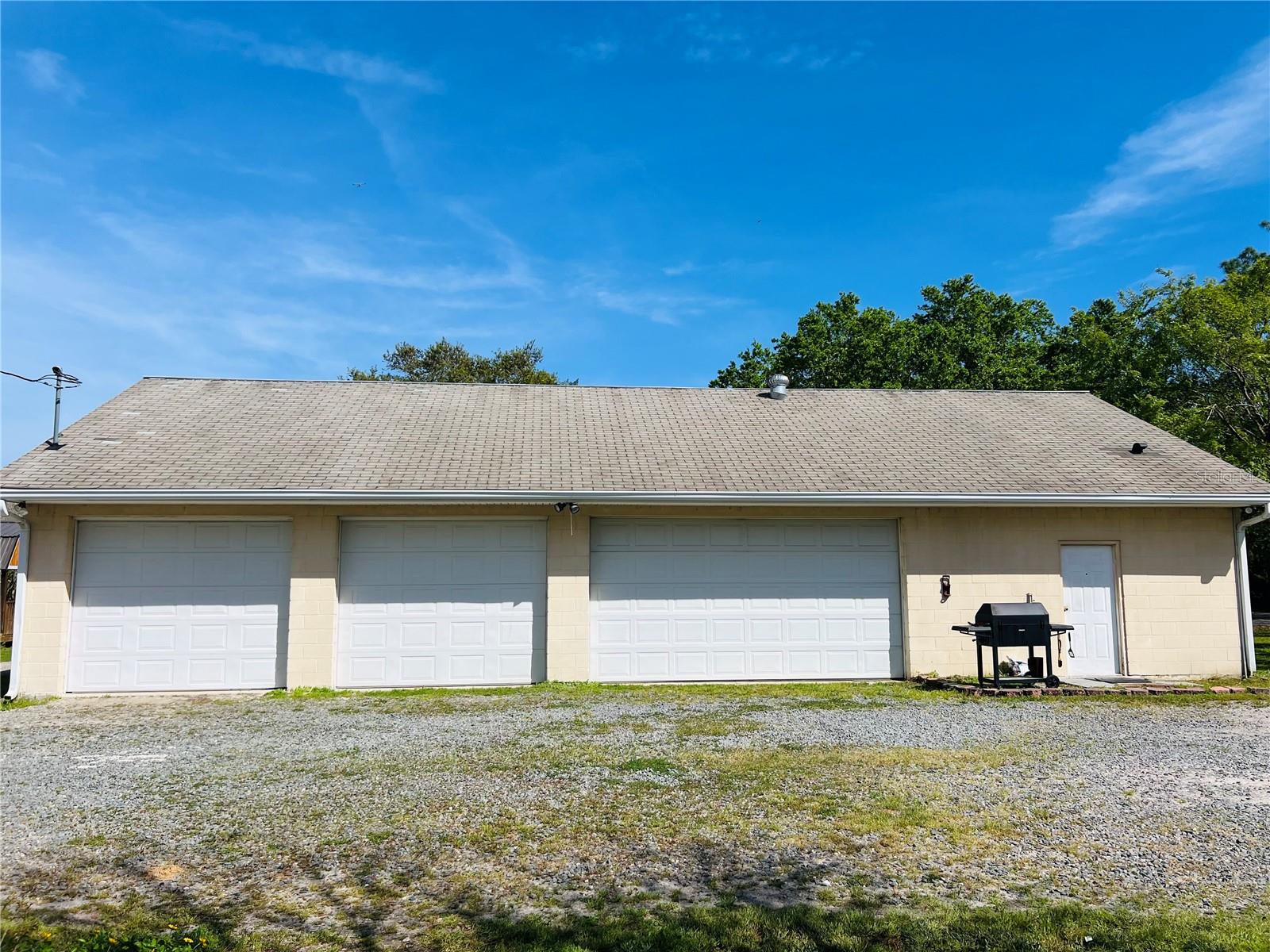 Amazing property that includes five acres (cleared and fenced) with a 30 X 60 three bay block garage, pond, large fire pit, small garden shed and high & dry lot ready for your dream build! Mature landscaping lines the gravel circular driveway with electricity and well on site. Owner is willing to negotiate money back for the small septic needed to convert garage into an apartment, office or man cave. Soooo many possibilities with this one!