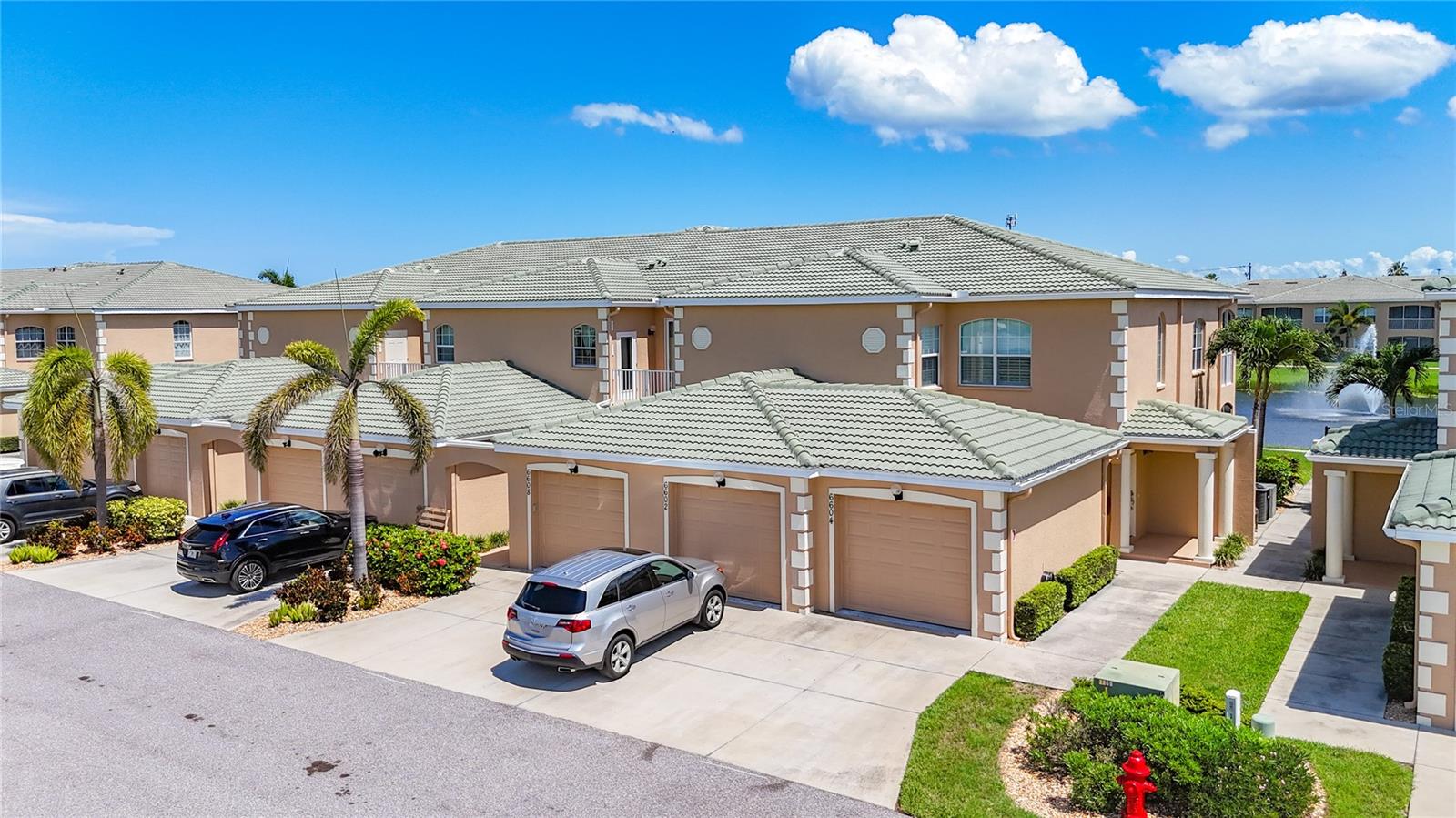 Come live in this most desirable community! This is a stunning 3-bedroom, 2-bathroom condo, built in 2016, with 1,486 sq ft of interior living space with bright and cheery beach colors throughout, furniture optional to purchase excluding the wine cabinet and wall decor. It's a part of the Hidden Lake community and features a detached one-car garage, granite countertops, solid wood cabinets, stainless steel appliances, gorgeous new wood flooring throughout the main living, plantation shutters, and a new AC in 2024. The community offers amenities like a fitness center, pool, hot tub, and clubhouse with a library, TV area, and kitchen for amazing social events. Hidden Lake is located near shopping, dining, and Anna Maria Island's beaches. Come enjoy the serenity of hearing and watching the beautiful water fountain in the 5 acre pond just out your own lanai.