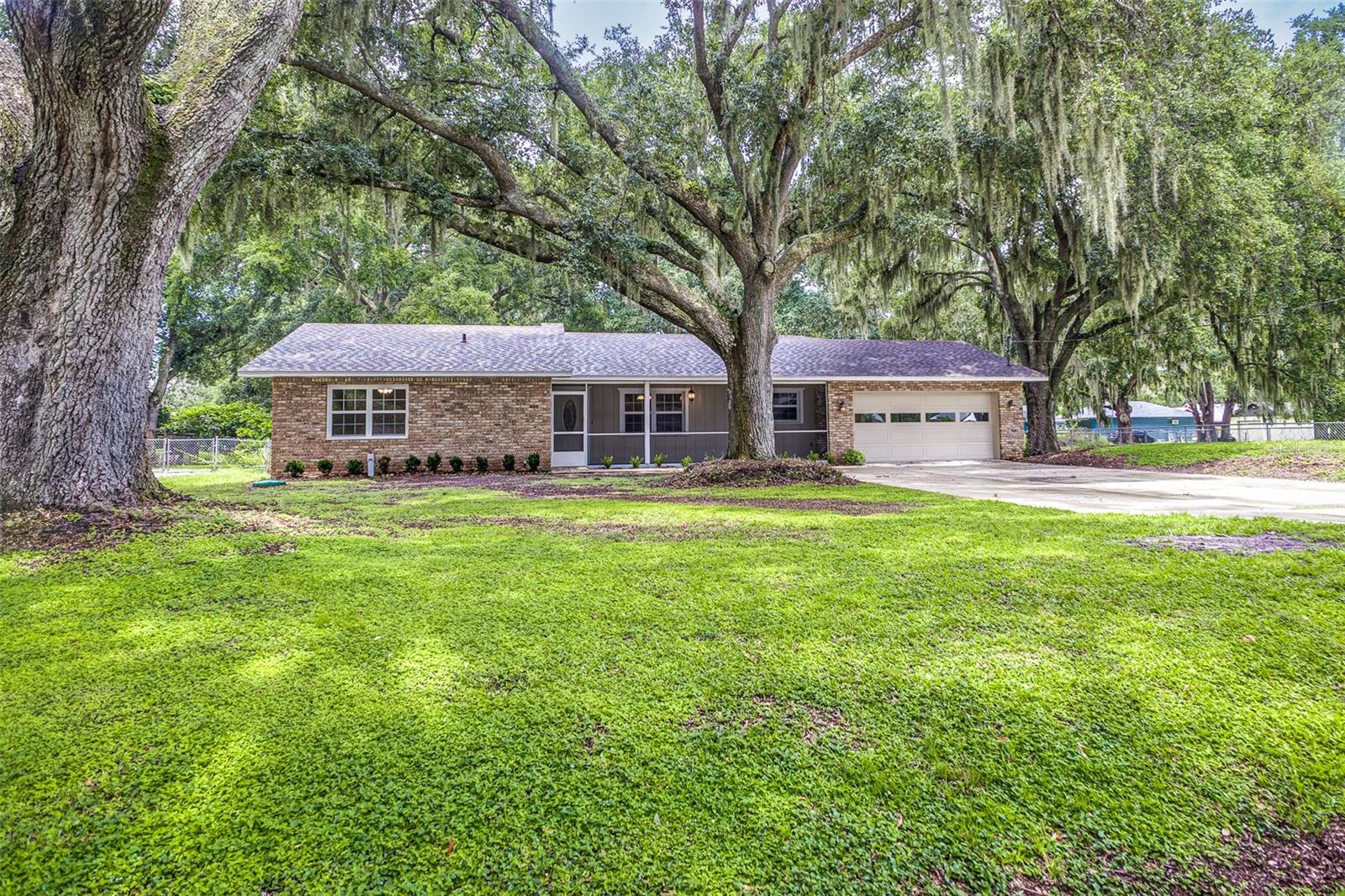 Newly Renovated 4-Bedroom, 3-Bathroom Home on Half an Acre in Quiet Bartow Neighborhood!
Welcome to this beautifully updated home, perfectly situated in a peaceful neighborhood. Sitting on a generous half-acre lot, this home offers both space and style for comfortable living.
Inside you’ll discover brand new luxury vinyl plank flooring and plush new carpet in the bedrooms. The spacious kitchen is a chef’s dream, featuring brand-new stainless-steel appliances—including a refrigerator, microwave, dishwasher, and range—plus a bonus wall oven and a mounted TV for added convenience to watch the news, cooking shows, or the big game. Just off the kitchen, the dining room provides an ideal layout for entertaining and family meals.
Relax in the large living room, complete with a charming brick fireplace, wood mantle, and built-ins on either side—the perfect centerpiece to this room. An additional oversized family room with beautiful French doors opening to the backyard.
The primary suite is a true retreat with a generous walk-in closet and a private ensuite bathroom featuring a double sink vanity. Three additional bedrooms and two more full bathrooms offer ample space for family and guests.
Outdoor living is just as inviting with screened-in front and rear porches, a fully fenced backyard, a playground set already built and ready for play, and a detached shed for additional storage or workshop needs. The home also features a spacious 500 sq ft garage and an additional storage room, providing plenty of space for vehicles, tools, and seasonal belongings.
Septic tank and drain field 2018. Newer A/C units. Windows 2017.