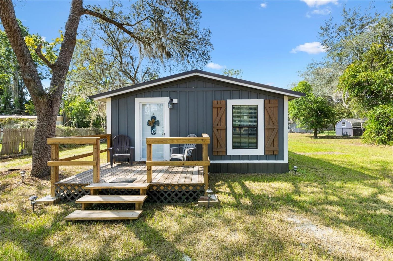 Tucked just minutes from the boat launch, in the heart of Florida’s Chain of Lakes, just off Haynes Creek, sits a charming retreat that feels made for slowing down and soaking it all in. Whether you're arriving with a fishing pole, a kayak, or just a good book, this completely remodeled 2-bedroom, 2-bathroom home welcomes you with open arms.
Step inside to discover 720 square feet of thoughtfully updated living space—every detail refreshed, from the new roof overhead to the new plumbing beneath your feet. The layout is cozy yet functional, ideal for a first-time homeowner, a snowbird seeking seasonal serenity, or someone ready to simplify without sacrificing comfort.
Outside, the large lot offers room to breathe, play, or park your RV—yes, there are RV hookups ready to go. A separate garage gives you space for lake toys, tools, or even a workshop. And the back porch? It’s your front-row seat to quiet mornings and golden hour reflections.
But what truly sets this home apart is its location. Surrounded by water, wildlife, and wonder, you're just minutes from great dining—whether you’re cruising in by boat or driving in from town. It’s a place where weekends feel like vacations and every day holds the promise of adventure.
This isn’t just a house. It’s a gateway to the lifestyle you’ve been dreaming of.
Contact today to schedule your private showing.
Buyer to perform their own due diligence. All measurements and property details should be independently verified.