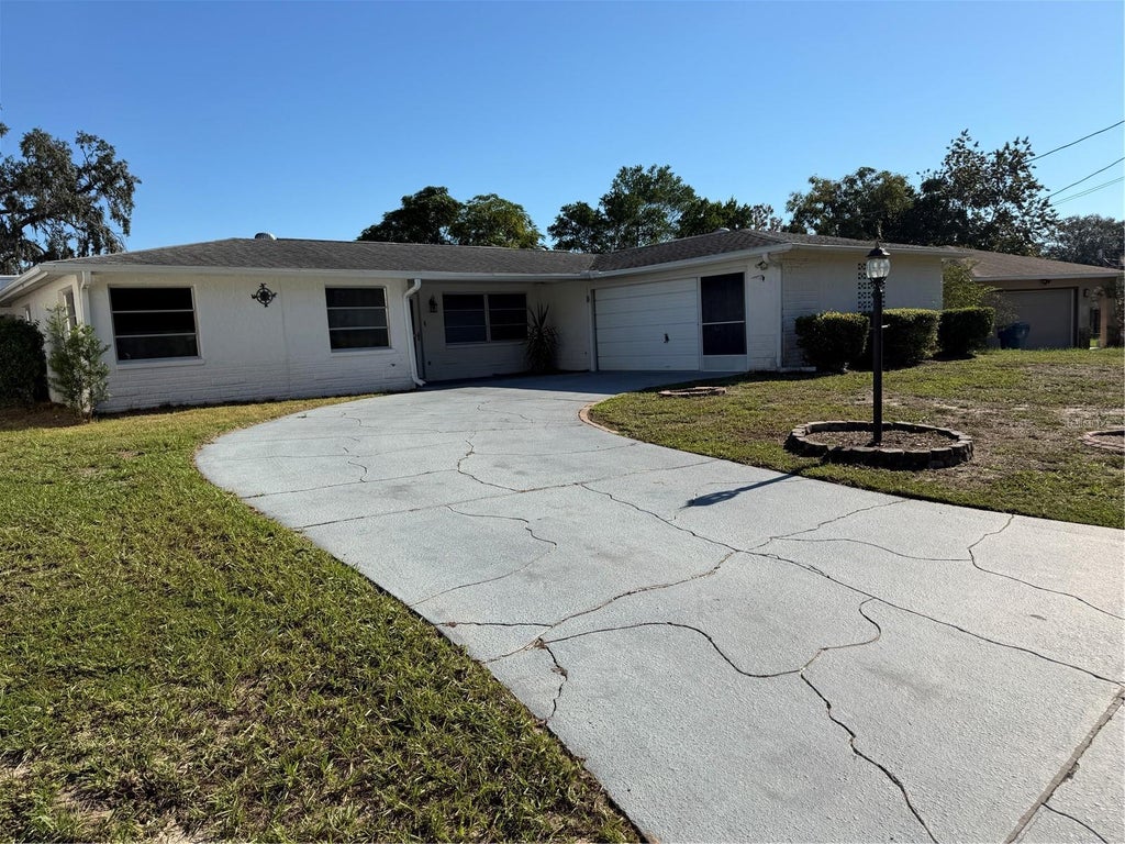 Photo of 7400 Hiawatha Parkway, Spring Hill, FL 34606 (MLS # TB8557036)
