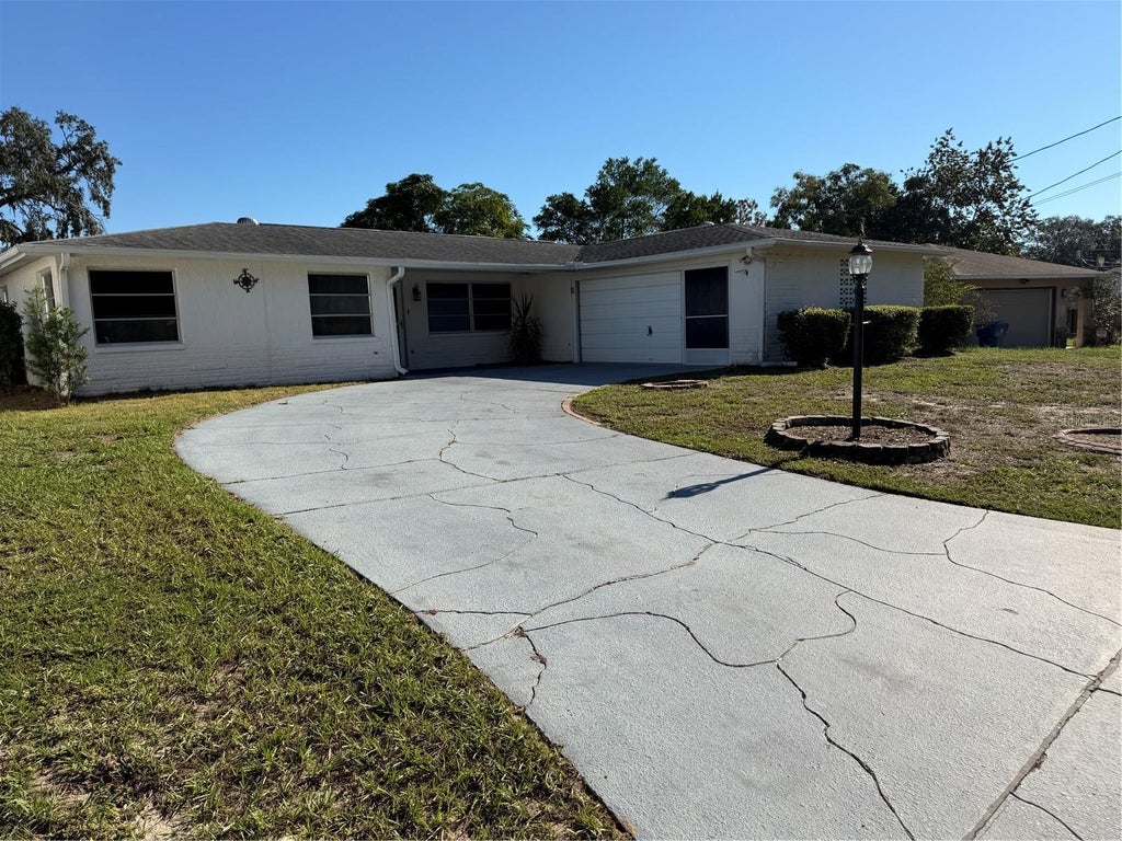 Photo of 7400 Hiawatha Parkway, Spring Hill, FL 34606 (MLS # TB8557036)