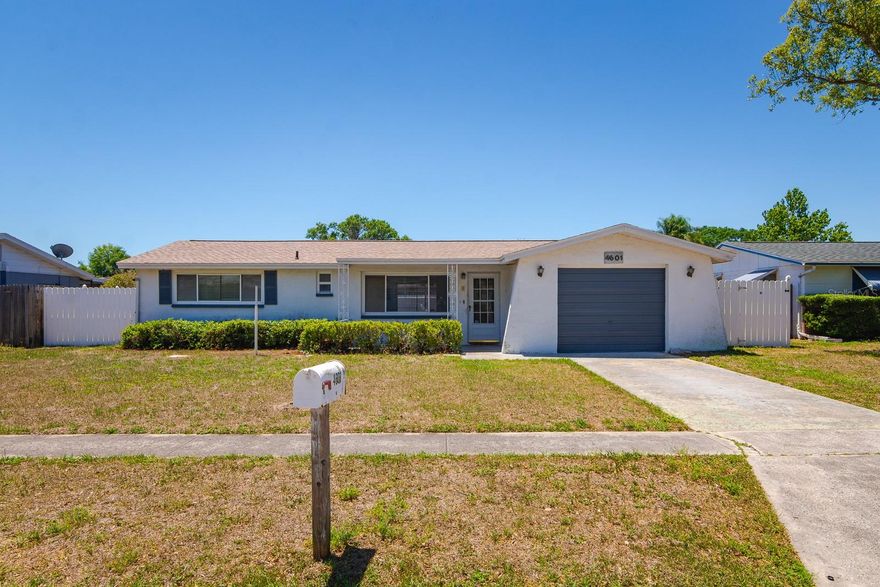 One or more photo(s) has been virtually staged. Whether you're a first-time buyer ready to stop renting or a young family looking for a place to truly call home, 4601 Durney St checks all the right boxes. This clean, move-in-ready 2-bedroom + Flex Space, 2-bath block home in New Port Richey is the kind of opportunity that doesn't come around often — especially at this price point. And the best part? No HOA, Non Flood-Zone, and No deed restrictions — your home, your rules. Let's talk about the big three: brand new roof (2025), brand new HVAC (2024), and a brand new water heater (2025). That means lower insurance premiums from day one and zero stress about major systems for years to come. Move in, get comfortable, and update at your own pace — this home gives you that freedom. Inside, you'll find tile flooring throughout all the main living areas and bathrooms, with vinyl in the bedrooms and laundry room — not a single inch of carpet in sight. The ceilings are clean and smooth, with no popcorn anywhere. Ceiling fans run throughout the home to keep things cool and comfortable year-round. The kitchen features solid cabinetry, great countertops, stainless steel appliances, and an eat-in dining space that opens naturally into the family room — perfect for everyday living and entertaining alike. The primary bedroom includes a step-in closet and a private en suite bath with a shower. The converted garage gives you a true third bedroom plus a dedicated laundry room — a rare and practical bonus you'll appreciate every single day. Step outside and you'll fall in love with the backyard. A large brick paver patio sets the stage for weekend cookouts, and the enclosed covered screened patio means you can enjoy the Florida outdoors without the bugs. The fully fenced yard gives kids and pets plenty of room to roam. The location couldn't be more convenient. You're just minutes from US-19 and a quick shot to SR-54, giving you easy access to the rest of Pasco County and a straight run to the Suncoast Parkway — making the commute to Tampa smooth and stress-free. Add in the nearby shopping, dining, and the charming Downtown New Port Richey scene and you've got everyday convenience covered from every angle.