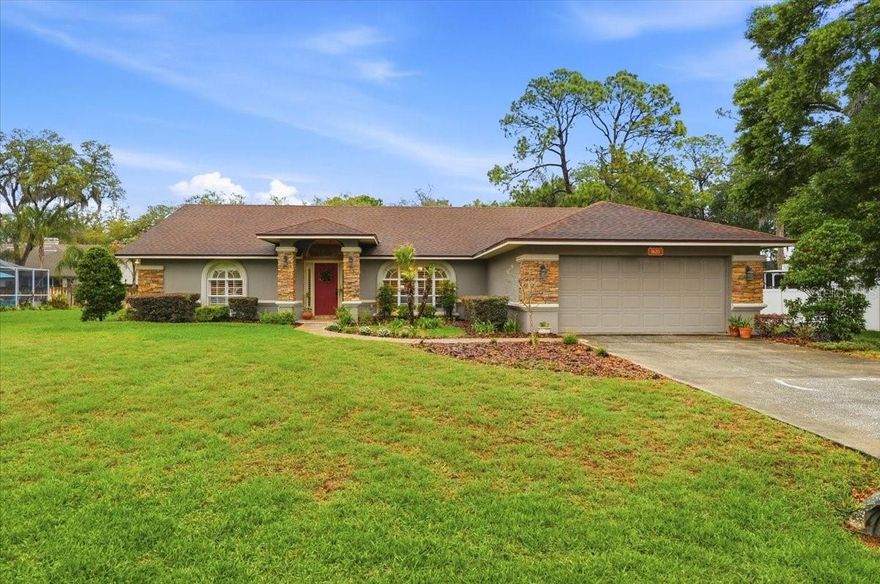 Welcome to this cozy and classic 4-bedroom, 2-bath home full of sweet Southern charm, located in the Derbyshire subdivision of the desirable Sherwood Forest community in North Lakeland. Known for its convenience, this location offers easy access to shopping, dining, schools, and I-4 for an easy commute to Tampa or Orlando. Situated on an oversized lot, this home provides plenty of space for outdoor living and everyday enjoyment.

Inside, beautiful hardwood floors flow throughout, complemented by a charming eat-in breakfast nook—perfect for slow mornings and everyday moments. The elegant dining room and family room combination offers both style and convenience, creating an ideal space for hosting and gathering with loved ones. The living room features a cozy gas fireplace, adding warmth and character.

A split floor plan enhances comfort and privacy, with guest bedrooms on one side of the home and the primary suite on the other. A Jack-and-Jill style bathroom connects the secondary bedrooms while also providing convenient access for guests—blending functionality with thoughtful design. Major updates include a roof (2018) and AC (2017) for added peace of mind.

Step outside to an oversized covered back porch, perfect for slow mornings, evening gatherings, and everything in between, all overlooking a fully fenced backyard with a freshly painted 6-foot privacy wood fence.

A true family home offering charm, functionality, and an unbeatable North Lakeland location.