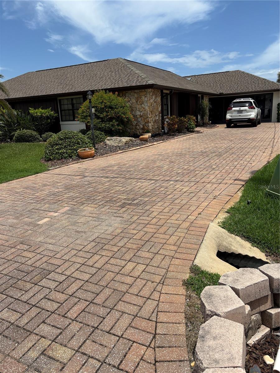 Amazing 3/2/2 Salt water canal home on 80x125 lot (.23 acre) This well maintained homes has a beautiful screened pool and covered boat house/lift for your boating needs which includes water and electric dockside. Located in a beautifully manicured cul de sac, this house has an updated kitchen with brand new stove, extra long pavers driveway, AC 2017, Roof 2017. Stone fireplace in large family room, fully enclosed Florida room that leads to screened , solar heated salt water pool and additional patio. Home has a nature lovers fully screened atrium. with access from master bedroom and family room. Spilt plan bedrooms, dual sinks in ensuite with custom walk in closet. Irrigation system makes green grass easy! Oversized garage has extra workspace with door that leads to the backyard. PROFESSIONAL Pictures coming soon. Motivated seller- present all offers!