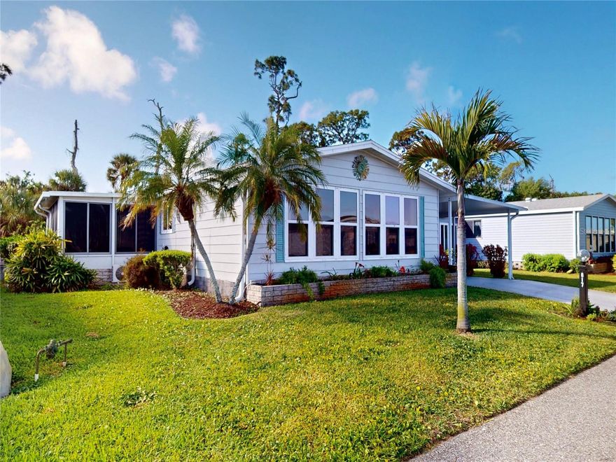 Welcome to the highly desirable Tangerine Woods where you own the lot!  Begin with the spacious living room, which is bursting with natural light. From there you flow through the study area into the kitchen and eating area, which overlooks the Florida room. Cooking is a pleasure with granite countertops, a huge island, a large pantry and a window over the sink. The Florida room complete with a split unit for heat and ac  overlooks the lush private wooded area in your backyard adding peace, privacy & serenity. Updates include roof (2023), flooring throughout, interior walls, paint and woodwork. This home is being sold turn-key, minus a few personal items and Florida room table and chairs. Additional features include a built in dry bar, a covered screened porch, a full laundry room with a utility sink and extra storage, a paver brick patio, a breezeway with more storage space, a Jack-and-Jill bath, and a carport with space to park bikes, a golf cart, or whatever you like. The golf cart can be included in the sale, but it is currently inoperable. Tangerine Woods is an active welcoming  55+ community filled with as many activities as you'd like to participate in at the affordably low HOA fee of $678 monthly. Enjoy pickleball, tennis, a fitness center, community room, crystal blue pool, spa  and a full time activities director and a wonderful social life. Conveniently located to beautiful Manasota & Englewood beaches, shopping, dining and nature trails. 2 pets are welcome. 90 day minimum rentals allowed.Now is the time to get your piece of the good life in sunny beautiful Florida.