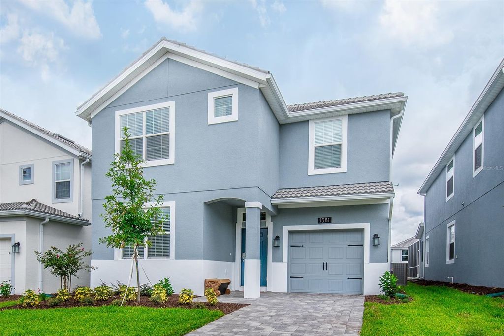 Photo of 1581 Tempo Lane, Davenport, FL 33896 (MLS # O6415815)