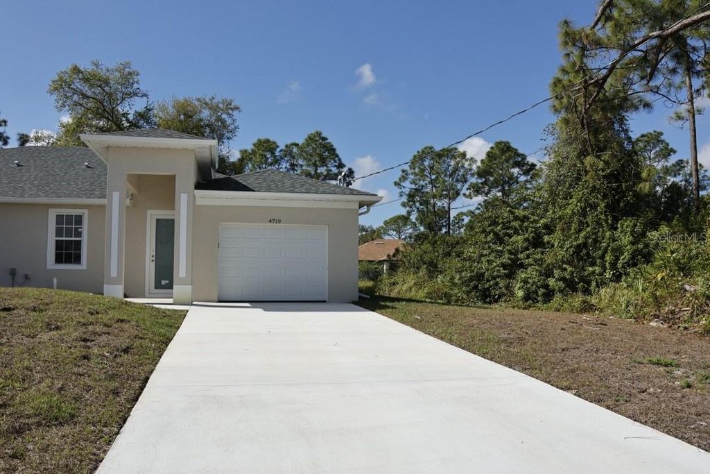 Photo of 4719 28th Street SW, Lehigh Acres, FL 33973 (MLS # C7523470)