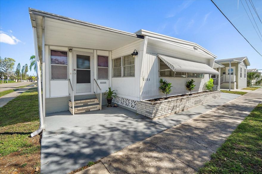 (Ask about possible financing!) -PRICE REDUCTION / PLUS INCENTIVES! SELLER HAS TO RELOCATE!  (See Virtual Tour link)

 CHARMING largely REMODELED/REHABBED TWO BEDROOM, TWO BATH plus sunroom in PARADISE PALMS Co-op owned park; HOA $210 monthly.  Corner lot facing quiet residential area. Newer attached 2-car carport & storage.  Quality new vinyl flooring throughout. Large wrap-around living and dining area, allowing room for entertaining. 
Attached SUNROOM (could be bedroom/family room) is 10 x 21 with central AC, giving you additional living space The two extra spacious bedrooms each have dual closets, built in dressers; primary with en-suite bath, double vanity, walk-in shower.  KITCHEN totally remodeled with new cabinets, granite counters, new high-end range (w/airfryer, "bread bake" feature...),& high-end dishwasher, custom back-splash, designer sink. This REMODEL included new outlets, GFCi's, some subflooring and walls reinforced/replaced as needed.  (Metal roof in 2017; 3-ton 14 Seer AC 3/2021. Permits show in 2017 "cast iron replaced with PVC, trailer to main.")  On-going Aardvark Pest Control Contract. AHS transferable Contract in place.
(SEE ATTACHED LIST OF UPGRADES, REMODEL details. Approximately $40,000 spent. (Seller's loss - your gain!)
Furniture/furnishings optional. SEE ATTACHED LIST of excluded items. 

COMMUNITY: Bradenton Tropical Palms is gated, has clubhouse, large heated pool, hot tub, fitness rooms, pickelball, shuffelboard, community center...you name it! 
LOCATION about half hour drive to Coquina Beach, Holmes Beach, Anna Maria Island. Sarasota-Bradenton airport a short drive, UTC Shopping Center and Ellenton Mall nearby.  Also near DT Bradenton Riverwalk, restaurants.