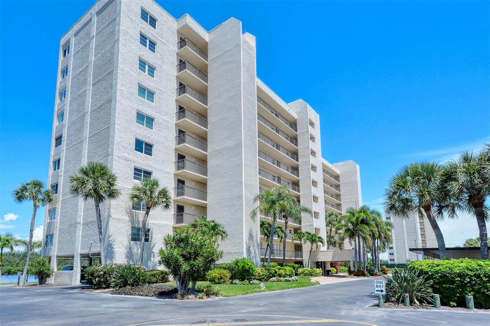 If you seek incredible views, look no further. Surrounded by water on three sides, enjoy the panoramic vistas on the southernmost end of Siesta Key. Look from the lanai to the east at scenic Neville Preserve and Little Sarasota Bay. The west-facing front of the unit is the perfect location from which to enjoy the spectacular Siesta Key sunsets with friends and neighbors. Step inside this beautifully updated turn-key furnished 2-bedroom, 2-bathroom unit and experience coastal elegance at its finest. The open-concept kitchen features stunning cabinetry, a quartz waterfall countertop, and sleek stainless steel appliances—ideal for entertaining or enjoying quiet mornings with a view. Crown molding and recessed lighting add a refined touch throughout the space. The master suite is a private retreat with a spacious bedroom, walk-in closet, and sliding doors leading to the lanai—offering peaceful water views to wake up to each morning. The en-suite master bathroom is a spa-like sanctuary, complete with a walk-in shower, quartz countertops, and a breathtaking tiled wall and shower. The second bathroom echoes this sophisticated design with quartz counters and beautifully tiled features. A large screened-in lanai invites you to unwind while soaking in the ever-changing hues of sunrise and sunset over the Intracoastal Waterway. Additional conveniences include an in-unit washer/dryer and an assigned covered parking space. A gated community, The Pointe is beautifully landscaped and features every amenity: a heated pool and spa, lighted tennis and pickleball courts, private boat docks, kayak and paddleboard racks and launch, exercise rooms, men's and women's saunas, clubhouse, a private island with a gazebo and grills, and on-site management and maintenance. This five-plus-acre property is conveniently located just a few minutes’ walk from Turtle Beach and three restaurants. Come live at the less-traveled, more tranquil end of the Key and enjoy the walking and bike paths under tree-lined Midnight Pass Road. Boat docks are available!! Capture the rental income for the 2026 season!