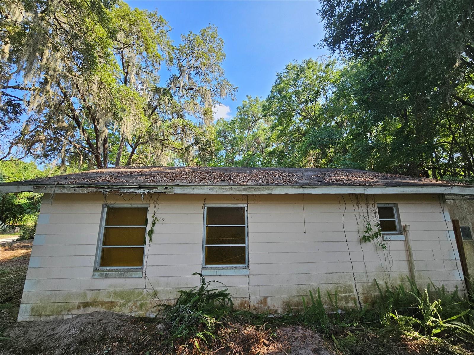 Nestled in the heart of Belleview, this 2-bedroom, 1-bath home sits on a 6.53-acre lot just minutes from shopping centers, grocery stores, schools, and restaurants. Conveniently located right off Highway 441/27, one of the busiest corridors between Ocala and The Villages. The home itself needs work and TLC, making it a great opportunity for investors, rehabbers, or developers. With its prime location near a busy shopping mall and dining options, this property is ideal for a fixer-upper, rental, or future development. Cash buyers only, sold as-is.