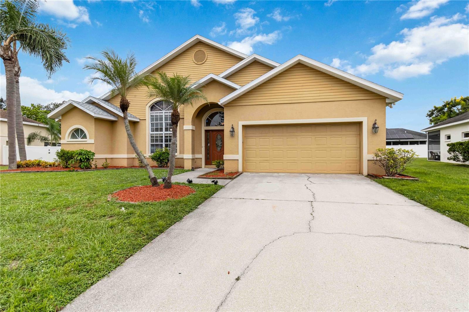 Welcome to this stunning four-bedroom home with an additional OFFICE that perfectly balances comfort with functionality. Situated on a peaceful cul-de-sac, this 2,166 square foot residence offers soaring ceilings and an open concept design that creates an inviting atmosphere for both daily living and entertaining. NEW ROOF & ELECTRIC PANEL 2024!
The heart of the home features a spacious kitchen adorned with granite countertops, providing both beauty and durability for the culinary enthusiast. Natural light floods throughout the interior, highlighting the thoughtful design elements that make this house truly special. The primary bedroom and three additional bedrooms offer flexibility for growing families, while the versatile den provides extra space for a home office or recreation area.
With two and a half bathrooms, including a convenient guest bathroom with direct lanai access – perfect for future pool installations – this home anticipates your lifestyle needs. The generous laundry room adds practical convenience to daily routines.
Step outside to discover your private oasis: a large backyard that offers endless possibilities for outdoor activities and relaxation. The community enhances your living experience with a sparkling pool, basketball courts and tennis courts, ensuring recreation is always within reach.
Location truly matters here. You're moments away from essential conveniences including Lowe's Home Improvement for weekend projects, Publix for grocery needs, and Pleasant Lake for outdoor recreation. The nearby bus station provides additional transportation options, while easy access to Interstate 75 makes commuting throughout the region effortless. Top-rated schools serve the area, making this an ideal choice for families prioritizing educational excellence.
This exceptional property combines suburban tranquility with urban convenience – truly the best of both worlds.