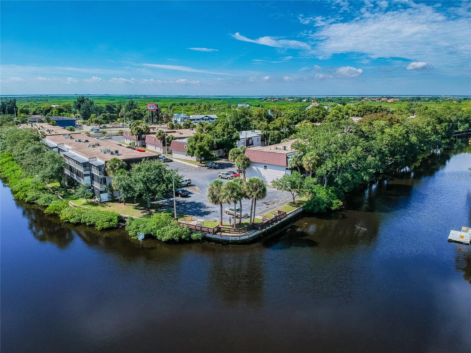 WATERFRONT LIVING, FULLY RENOVATED & GREAT LOCATION IN TAMPA! A very comfortable and open floor plan, your reserved parking space is right in front of your door, and your bedroom view is absolutely gorgeous, because it's direct WATERFRONT and WATERVIEW. Your screened-in lanai faces east, you will get to come home at the end of the day, sit out in the covered and screened lanai without the sun beating in on you and enjoy the boats, birds, manatees, porpoise and fish that frequent the waterway. The river/canal is fed from freshwater lakes and Old Tampa Bay, and with change of tides, is a mix of fresh and saltwater, making it brackish. There is a washer/dryer combo in your condo, but a full laundry just across the street near one of the pools, in case you want to get multiple loads done at once. The other pool, tennis courts, racquetball courts, boat and trailer parking and property manager's office is on the far west side of the property. Some decks/docks with benches are built within another common park area (just to the north a few hundred feet from your condo), over the seawall and grills are located there. Tampa International Airport is only 6 miles away, Clearwater Beach is 20 miles away, Downtown Tampa is only 11 miles away, and Downtown St. Pete is only 23 miles away.