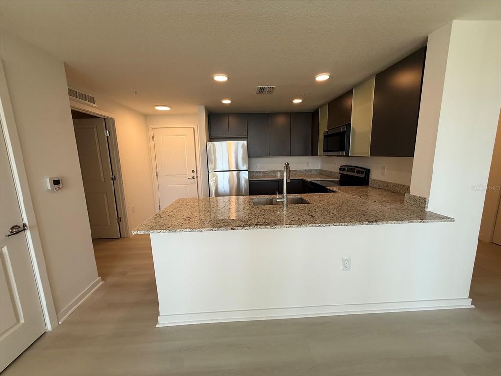 Photo of 5579 Millenia Park Boulevard #410, Orlando, FL 32839 (MLS # O6398893)