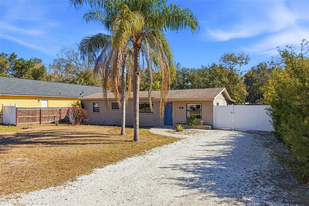 Photo of 10405 N Woodmere Road, Tampa, FL 33617 (MLS # TB8475468)