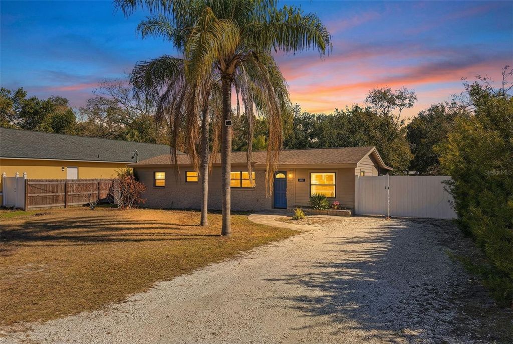 Photo of 10405 N Woodmere Road, Tampa, FL 33617 (MLS # TB8475468)