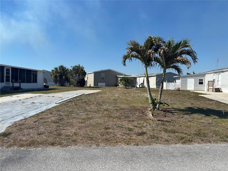 Here is your chance to own a piece of paradise! This prime lot is located in the highly sought-after Village of Holiday Lake, a waterfront community featuring PRIVATE DOCKS and a COMMUNITY BOAT RAMP with QUICK ACCESS TO OPEN WATER, Charlotte Harbor, and the Gulf. Conveniently situated within walking distance to the Recreation Center, COMMUNITY POOLS, and sports courts, this property also offers a partial canal view for added charm and tranquility.

OWN YOUR OWN LAND with no age restrictions in this active, amenity-rich community. The Village of Holiday Lake offers 25+ boat slips, two heated pools, BBQ area, FITNESS CENTER, laundry facility, craft room, woodworking shop, tennis courts, PICKLEBALL, shuffleboard, and a large recreation hall with a full kitchen. GOLF CARTS ARE WELCOME, making it easy to enjoy everything the community has to offer.

Outdoor enthusiasts will appreciate the excellent boating and fishing opportunities right from the community docks and boat ramp, along with several Gulf beaches just a short drive away. Golfers will love being close to some of the area’s finest golf courses. Enjoy nearby waterfront dining favorites including Gerry’s Tiki Hut, TT’s Tiki on the Water, and SandBar Tiki & Grille, accessible by both boat and car.

Whether you are looking for a year-round residence, seasonal retreat, or investment opportunity, this lot offers the perfect Florida lifestyle.