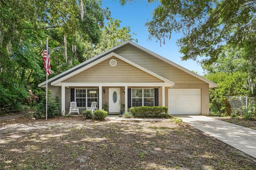 Welcome home to comfort, simplicity, and a peaceful setting in Eustis. Tucked away among mature trees, this charming property offers a relaxed lifestyle with just the right amount of space—designed for easy living and everyday comfort. Inside, you’ll find a functional and inviting layout with comfortable living areas, a spacious kitchen with ample cabinetry, and a cozy living room centered around a fireplace—perfect for everyday living and quiet evenings in. The bedrooms are well-sized with great natural light, and the overall layout offers flexibility to suit a variety of needs and stages of life. Step outside to enjoy the shaded yard, offering a private, tranquil setting for morning coffee or unwinding at the end of the day. The property provides a sense of retreat while still being conveniently located near shopping, dining, medical facilities, and everyday essentials. Situated in Central Florida, you’re approximately an hour from Orlando’s world-renowned attractions, including Disney, and within easy reach of the beaches—making weekend getaways simple and accessible. Opportunities like this—offering both peaceful surroundings and everyday convenience—don’t come along often.