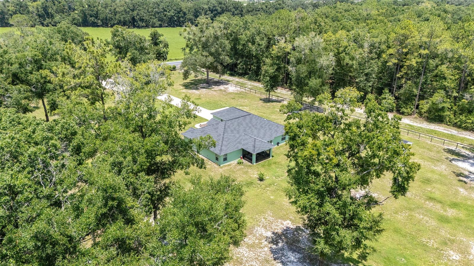 Gorgeous Morriston Farm Just 15 Minutes from the World Equestrian Center! Welcome to this beautifully built Triple Crown home offering the perfect blend of modern comfort and country charm. Nestled on 3 spacious acres, this 3-bedroom, 2-bath, 2-car garage home is just minutes from all of your basic needs, yet provides the peaceful privacy of farm life. Some of the Highlights of this home include: an Open-concept layout with a large family room and kitchen, durable tile in the main living areas, cozy carpet in bedrooms, and elegant quartz countertops in the kitchen and bathrooms. The property also includes an expansive farm setting, with an oversized carport—perfect for trailers, equipment, or gatherings. Bring your horses and furry friends—there’s plenty of space for animals and farm life. This home is also located in a Prime Location: 15 min to WEC, 20 min to Dunnellon or Central Ocala, 30 min to Gainesville Airport. Approx. 2 hrs to Orlando & Tampa theme parks and airports. This is the ideal property for equestrian lovers, hobby farmers, or anyone seeking space, style, and convenience in the heart of North Central Florida.
