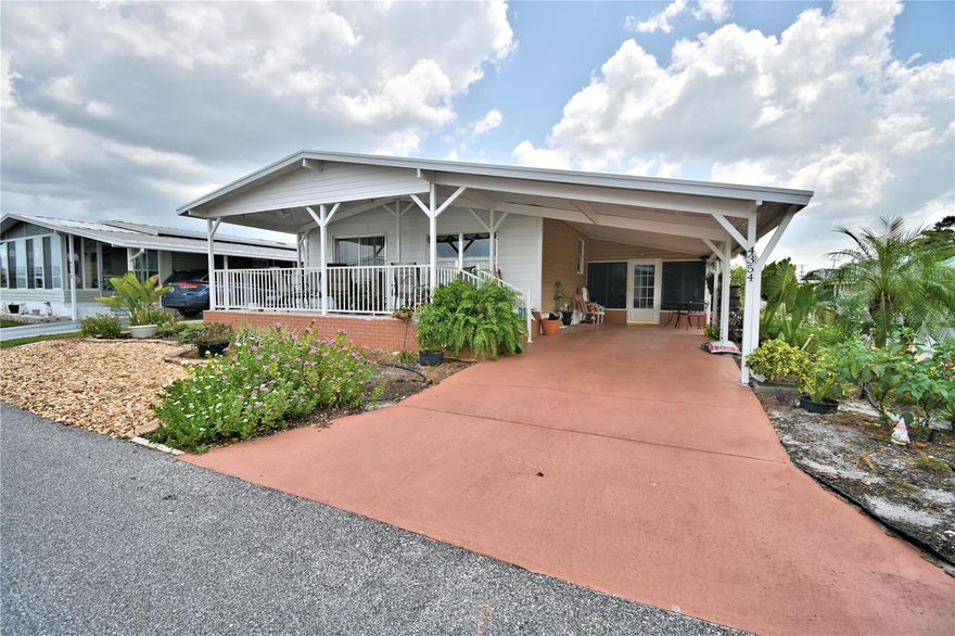 Pack your bags and move right in.  This spacious home is located on a corner lot with no mowing needed.  All the furnishing will stay with this home less personal items.  The open front porch is brand new and perfect for that morning cup of coffee.  The side Florida room offers extra living space for entertaining or could be perfect for your craft room.  The kitchen is very functional with a newer cooktop and a nice pantry for storage.  The master bedroom offers lots of space with a huge walk in closet as well as lots of storage.  Thanks to Ian, there is a new roof.  The HVAC is 8 years old.  Oakwood Estates, a 55+ community offers many amenities and well as activities.  You can be as busy as you would like or just sit on that perfect front porch and watch the world go by.  This home is located in the No Dog section, but indoor pets such as birds, cats, and fish are allowed.  Make your appointment today!!