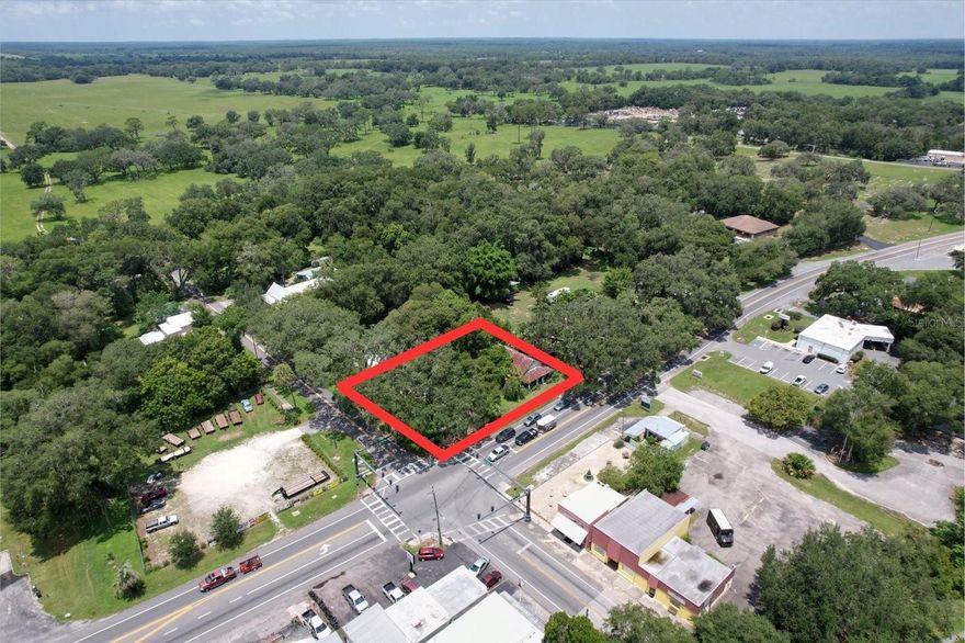 Introducing a unique oppurtunity to own a prime Floral City comercial property in an ideal location! Property sits right in front of a traffic light at the corner of US-41 and Orange Ave. Property is approximatley .3 acres with a 4,380 SqFt warehouse and a 1,550 SqFt home both in need of serious rennovation/teardown zoned for GNC allowing for a wide range of commercial options. Traffic count for Orange Ave is 6,100 AADT and US-41 S north of Orange Ave is 10,800 AADT. This property boasts a rich historic background being in the same family since 1920 and use to be a bus station, gas station and auto shop. Whether you're looking to expand an exsiting enterprise or start a new one this property offers a blank canvas ready to be transformed to suit your needs.