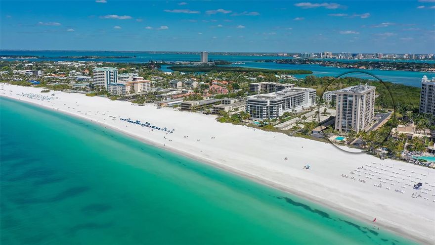 Lido Beach Club is a gulf front beach property offering water views and great amenities.  This fifth floor 2 bedroom 2 bath unit has southern exposure and a 30 ft  balcony with gulf and beach views from every room.  Large room sizes and a split plan provide a spacious feel and privacy.  This unit has been tastefully updated with porcelain tile throughout the living areas, kitchen, and baths.  Unit features crown molding, custom cabinetry, and window treatments. There are granite countertops in the kitchen, breakfast bar, and both ensuite bathrooms.  Impact hurricane windows and sliders provide protection and quiet tranquility.  The air conditioner and water heater were replaced in 2020.  Lido Beach Club has passed the building Milestone inspection.  Inside the unit there is a washer and dryer as well as laundry facilities across the hall.  This unit is being sold furnished.  Lido Beach Club offers a beautiful gulf-side pool, club room, fitness center, and on-site building manager.  Conveniently located near nature trails, kayak launch at South Lido Park, shopping and dining on St. Armand's Circle, and is next door to the popular Ritz Carlton Tiki Bar.  This unit sustained no damage from recent  hurricanes.  The pool area and landscaping has been renovated.