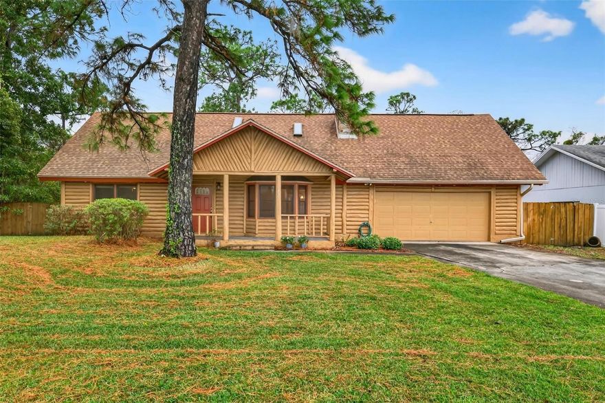 One or more photo(s) has been virtually staged. Escape the ordinary and discover a truly unique piece of county living in this stunning log home nestled at the end of a very quiet street in the heart of Seminole County. This rare find delivers rustic charm and privacy without sacrificing convenience, offering four spacious bedrooms and two large living areas anchored by a cozy wood-burning fireplace. The welcoming kitchen thoughtfully overlooks the dining area and downstairs living space, creating a perfect environment for entertaining. The rear of the home is a true retreat; relax on the large covered porch that seamlessly transitions to the generously sized, screen-enclosed pool. This private haven offers ultimate tranquility with an oversized lot and the added benefit of no rear neighbors—if you are looking for elbow room and a peaceful setting, look no further. Peace of mind comes with a roof replaced in 2018 and a new electrical panel with generator connections, plus plenty of storage in the oversized two-car garage. This one-of-a-kind property is ideally located just minutes from public schools, the Altamonte Mall, major hospitals, and all primary highways, offering the best of both worlds. Schedule your private viewing today!