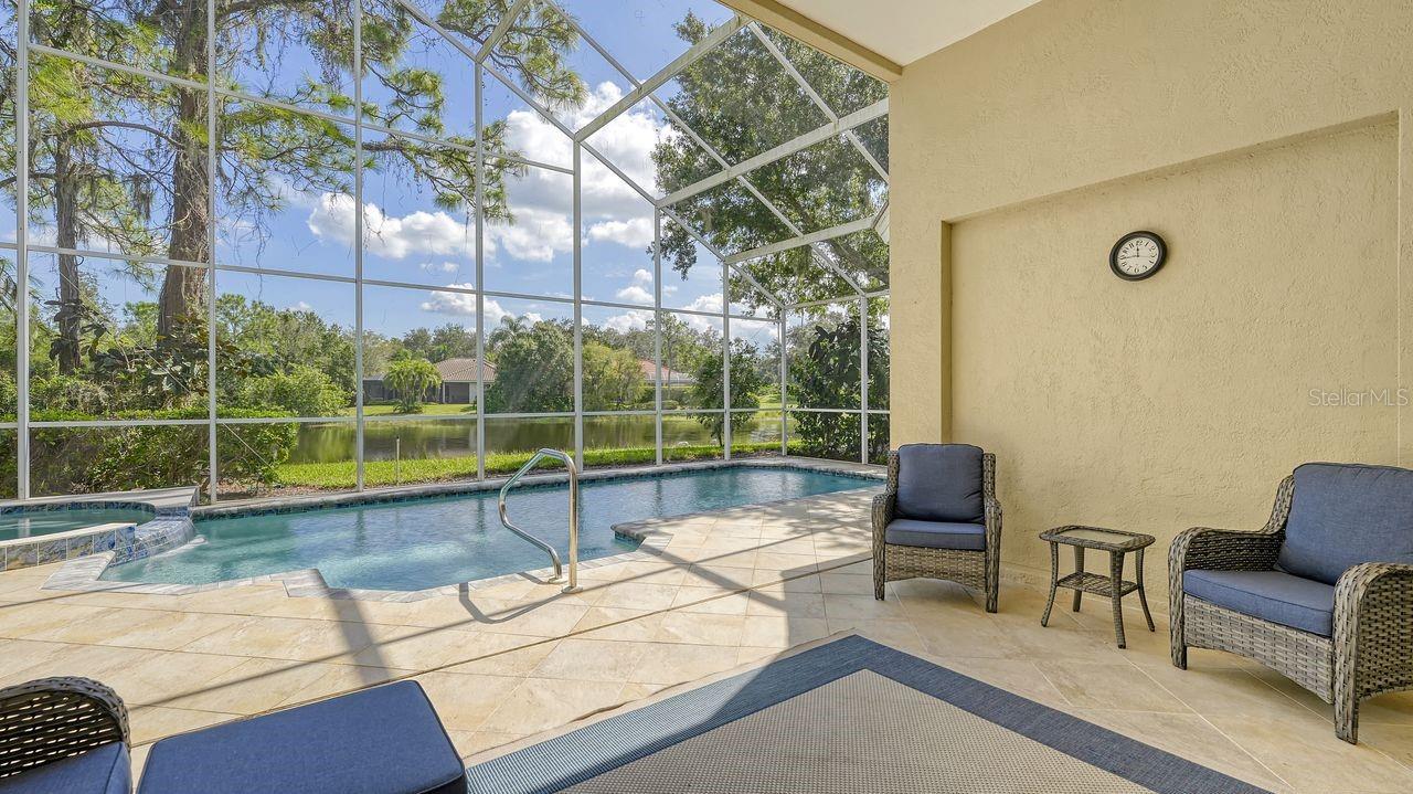New Roof installed in 2023. New 1600 SEER HVAC installed in 2023. New Air Condition Duct replacement installed in 2024, New saltwater pool and spa equipment installed in 2024, New Pool Surface in 2024, New Garage Door tracks, rollers and opener installed in 2024, New toilet in Main Bath in 2024, New Gutter installation in 2024, New Water Softener installer in 2024. Prepare to be captivated by fine finishes, privacy and desirable rear water views along the sixty feet of lake front. This luxury pool home, with beautiful lake views and open floor plan is a must see. Located in elegant University Park Country Club the lifestyle you desire is waiting for you here with landscape maintenance, services, irrigation, cable and internet provided by the association. Offering a catalogue of recent improvements, conveniences and the bonus feature of no flood insurance required, 7217 Churston Lane is a quality residence. The floor plan's seamless flow is roomy, inviting and offers ample space for entertaining. Soaring ceilings and 2,216 square feet of living space create a robust volume within the living area. Two bedrooms that are separated by the office and two full baths provide plenty of privacy. Be sure you don't overlook the convenient half bath at the pool. With furnishings available, this beauty is move in ready! The primary bedroom features high ceilings and beautiful bump out windows providing direct views of the private saltwater pool, spa and lake. The kitchen is equipped with stainless steel appliances, including a gas range and an exhaust fan. The kitchen also boasts a kitchen island and a breakfast bar open to the great room with quartz countertops, creating a functional and inviting space for meal preparation and gatherings. The eat-in kitchen is separate of the great room along a large window, providing for abundant natural lighting. The home features a fireplace, providing a cozy and warm atmosphere for residents to enjoy. The rear outdoor living space includes a larger covered area, wet bar, private pool and spa with a pool bath overlooking the lake. The property features a paved driveway. The residence is nestled within the community of Virginia Water a very short distance to the University Park Country Club inside amenity rich University Park. Every luxury detail has been thoughtfully provided for you. Quality maintenance presents the luxury property in tip-top shape. A screen enclosed front porch invites your guests to the elegant front double doors. Don't let the opportunity to own this amazing residence pass by.