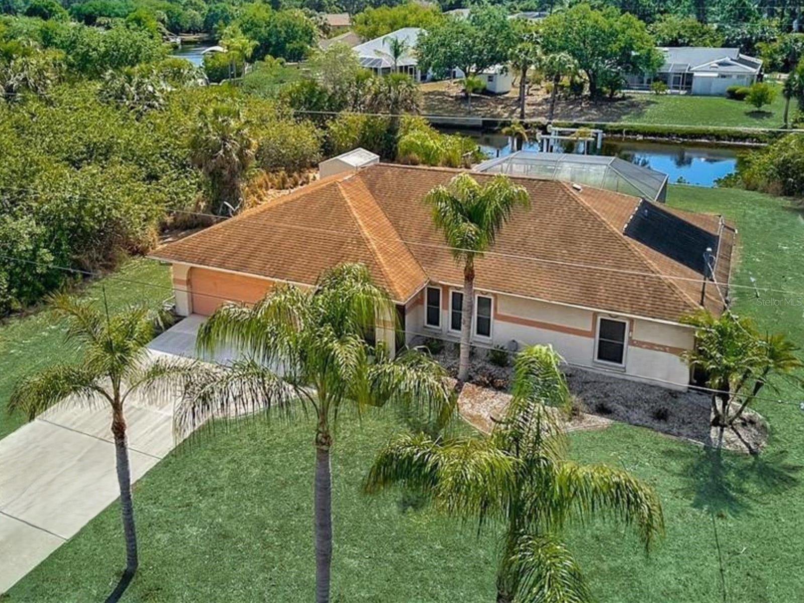 A charming three-bedroom, two-bathroom pool home located on a canal with a fishing dock is available for your next vacation! Comfortably furnished, cozy home with everything you need to make your Southwest Florida vacation perfect. Fully stocked kitchen, 3 bedrooms with queen-sized beds, and the primary bedroom has its own en suite bathroom. The lanai and pool area overlook the canal, where you will find a dock for fishing! Call our office to schedule your 2025 summer vacation or if you are looking to escape the cold, snowy weather up north, reserve this home for the 2026 winter season.