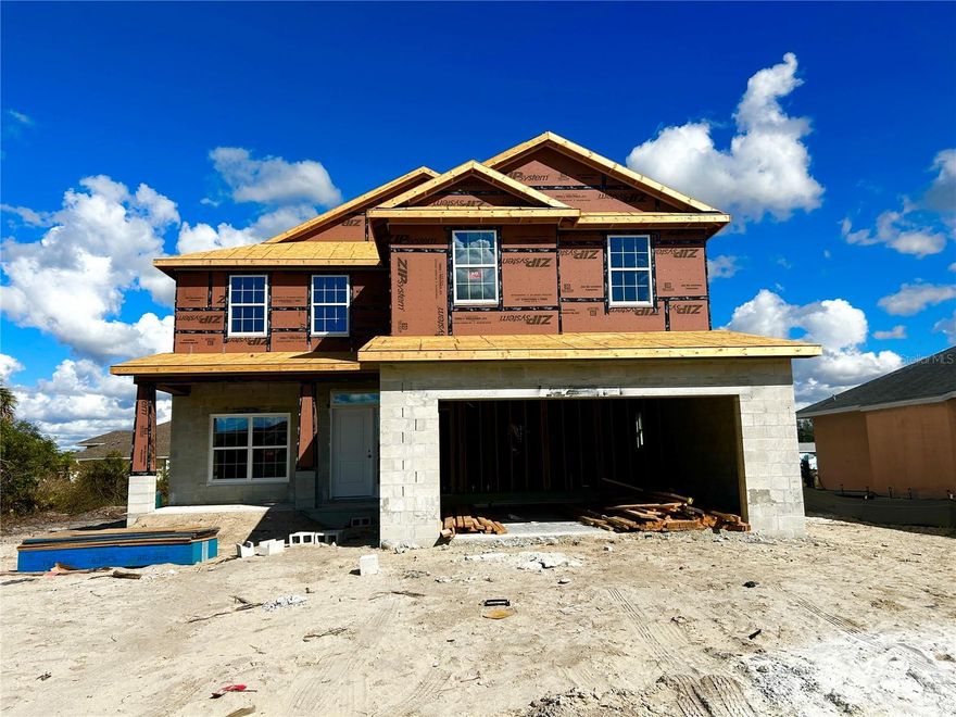 Under Construction. LOOKING FOR A HOME WITH LOTS OF SPACE?  This home will have plenty of room for your family with 5 bedrooms & 3 1/2 bathrooms plus a spacious loft and storage room.  The curb appeal on this home will make you the envy of the neighborhood.  The front porch offers a lounging area for family time and a space to greet your neighbors.  The open floor plan allows for a spacious living area for family get togethers.  The primary bedroom and bathroom are on the ground floor along with a powder room for guests.  UPSTAIRS you will find a HUGE 17'X19' LOFT area that could be used for a movie/game/study room for the kids, plus 4 bedrooms, 2 full bathrooms, laundry room & large storage closet.  ADAMS HOMES ALSO INCLUDE:  Builder 1/2/10 year warranty, in wall pest control system, irrigation system, hurricane shutters, large double pane low e windows (to let in lots of natural light), 50 gallon hot water heater, granite counter tops in kitchen & bathrooms, ceramic plank wood look tile in living, dining & wet areas (not vinyl flooring), 5 1/4 baseboards, bronze fixtures & hardware, wired smoke alert system and LED recessed lighting.  THE DEEP CREEK COMMUNITY OFFERS:  2 convenient ramps to I75, Public Golf Course with optional memberships available, tennis/pickleball courts, basketball court, playground, many neighborhood shops & restaurants within the community, city water & sewer to all homes, many greenbelts throughout the community and behind most homes, NO CDD FEES & very reasonable HOA fees of only $210/year.  15 minutes to Historic Punta Gorda & The Punta Gorda Airport and only 20 minutes to Port Charlotte Beach Park & Town Center.  Photo is of another home that is the same model.