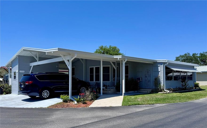 Large 2BR/2BA doublewide in the lakefront community of Floral Lakes. Large corner lot.  Well maintained, freshly painted outside and ready for a new owner.  Floral Lakes is a 55+ community located in a quiet area of Bartow, Florida with low fees. Enjoy the amenities including a clubhouse, shuffleboard, community pool, fishing and boat ramp to name a few. This home is not lakefront.  Home features formal living room and dining, large kitchen, extra large primary bedroom suite, plus inside laundry room with desk area.  Utility and storage outside with 2 car carport and golf cart parking. Call to see your new home.